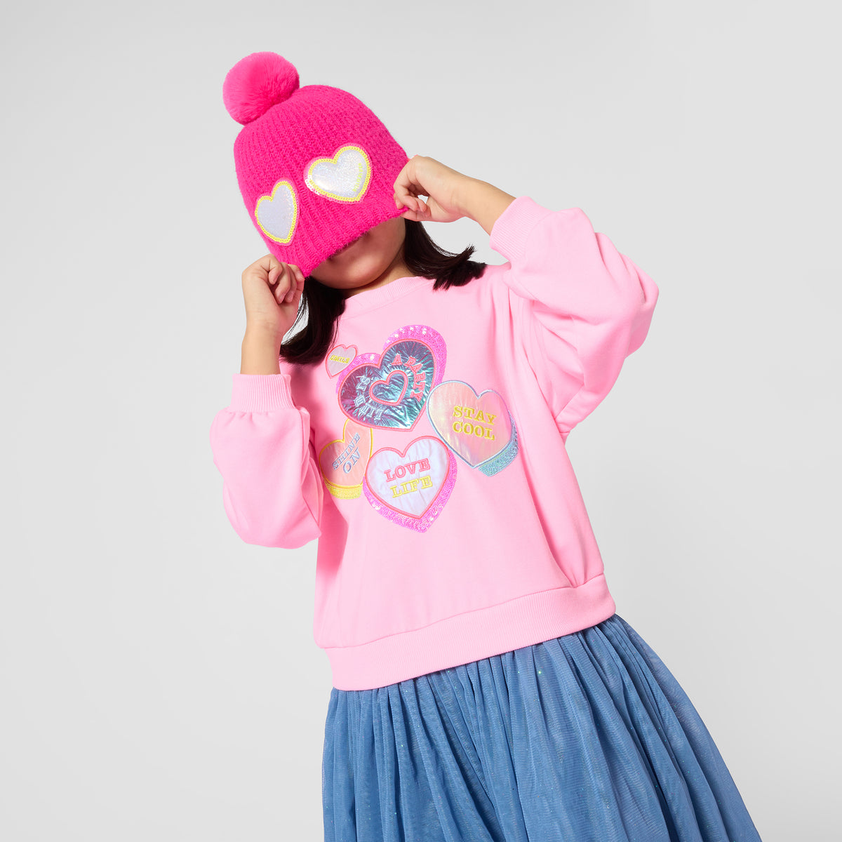 Billieblush girls sweatshirt-style dress with blue skirt styled with pink hat