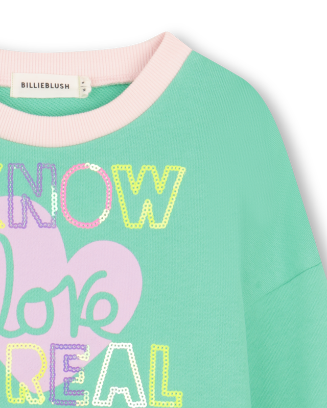 Billieblush girls green sweatshirt close up of slogan detail.