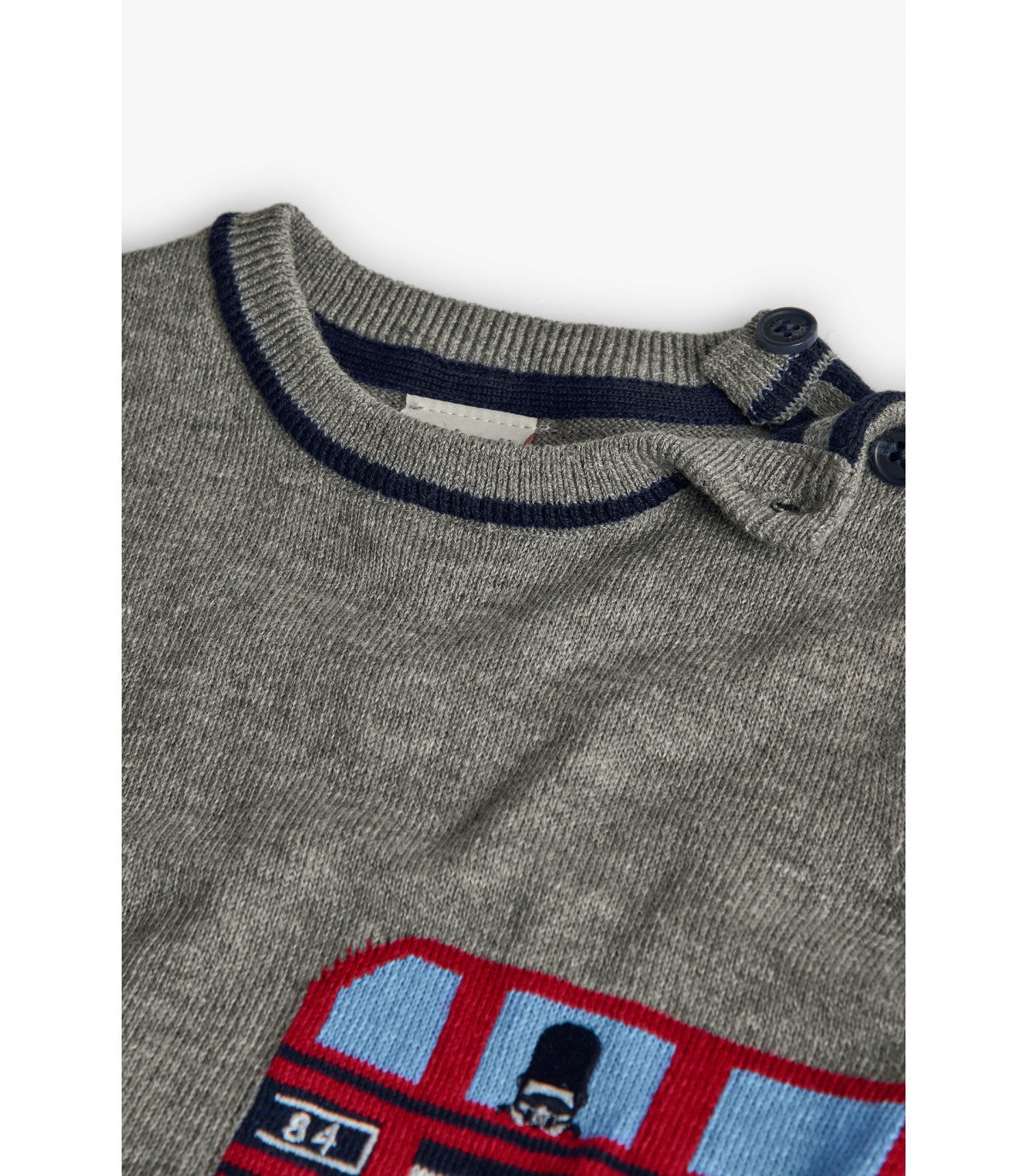 Close-up of Boboli boys bus motif jumper neckline with buttons
