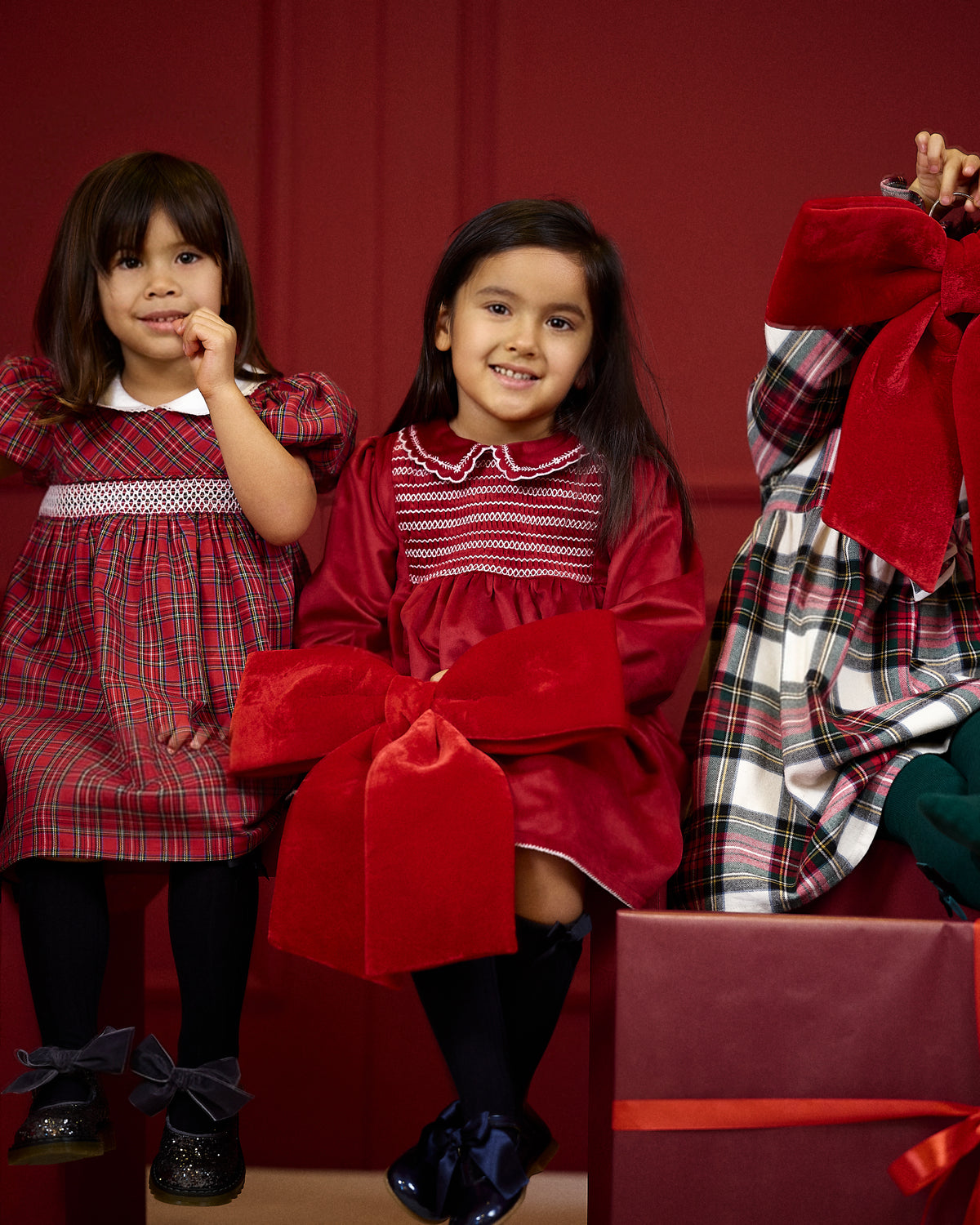 Deolinda Noelle girls tartan Christmas dress in festive campaign setting