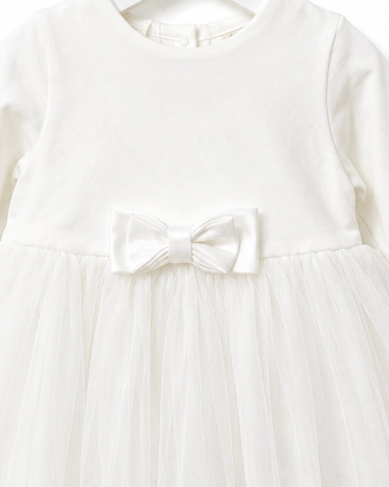Close-up of the embroidered lace hem on the iDO Mini ivory tulle christening dress