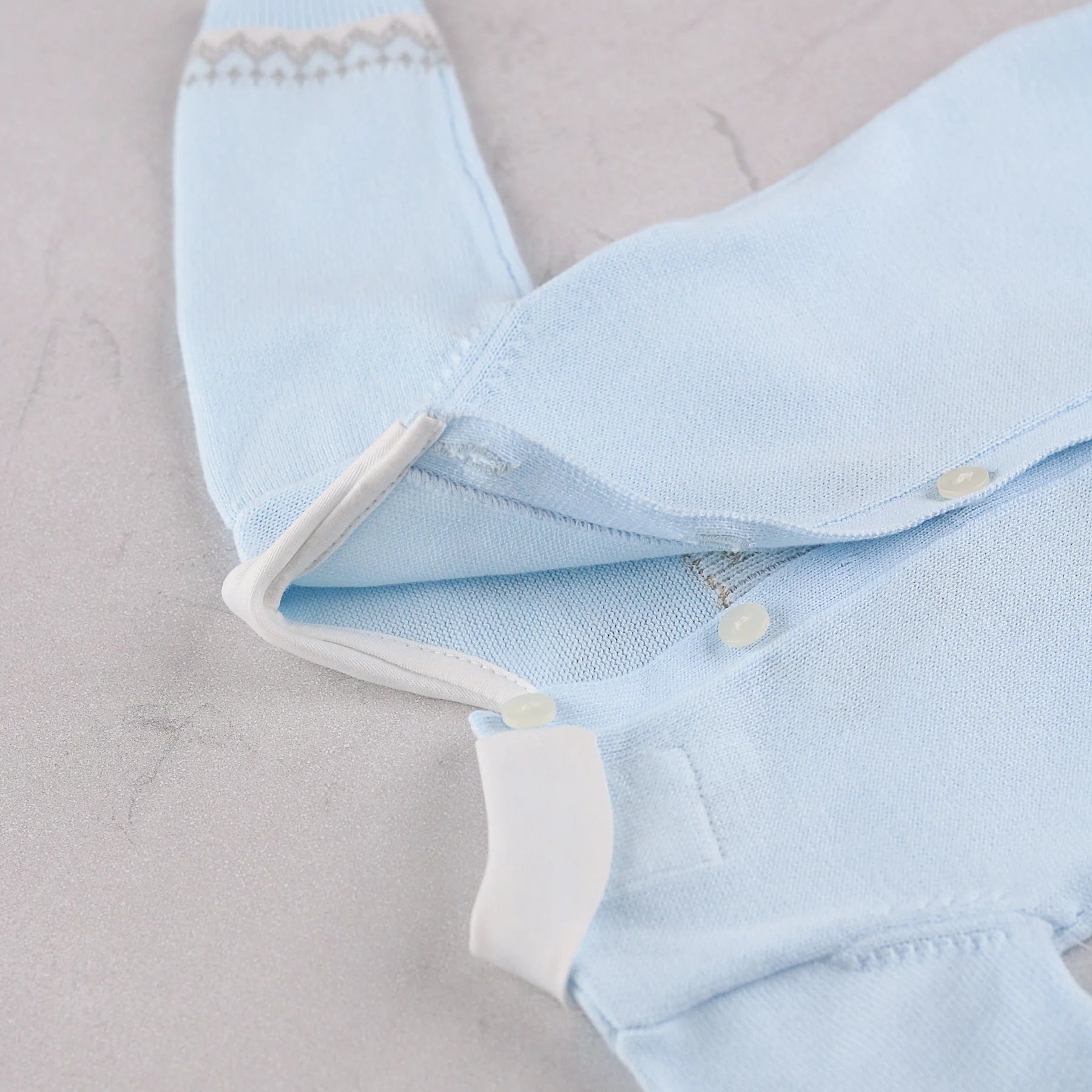 Emile et Rose Milo baby boys knitted romper neckline and button fastening detail