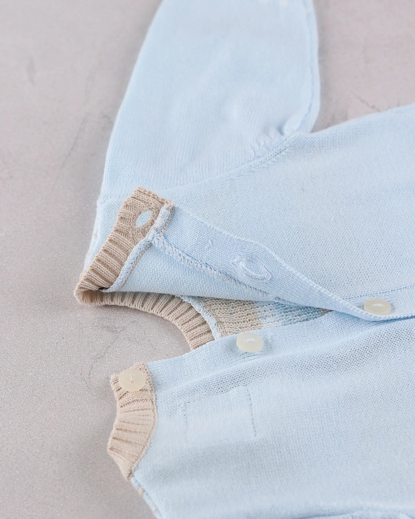Emile et Rose Magnus blue knitted baby boys romper button back fastening detail