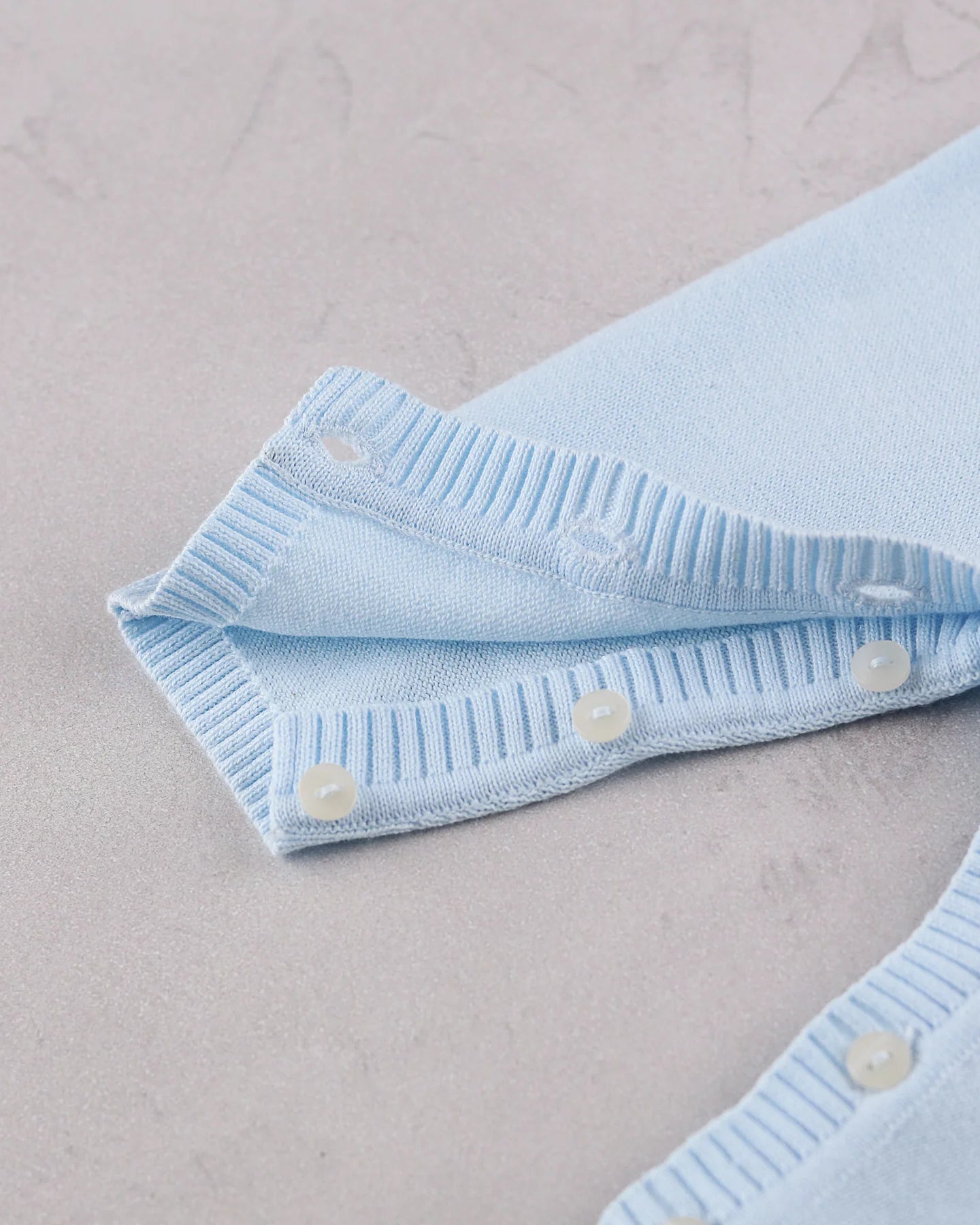 Emile et Rose Magnus pale blue baby boys romper leg and foot button detail