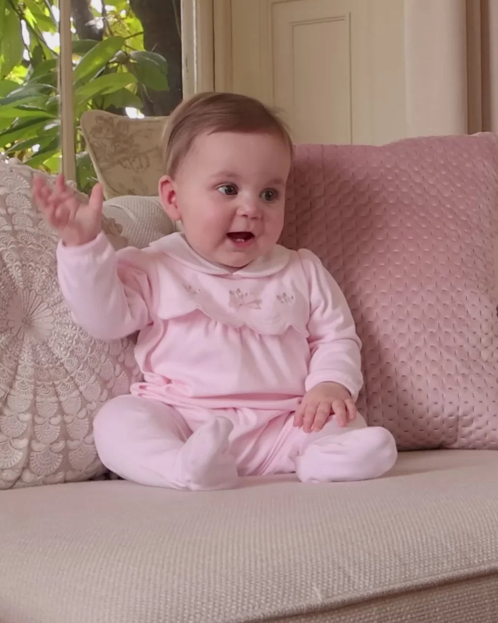 Baby girl wearing Emile et Rose Matilda pink cotton babygrow