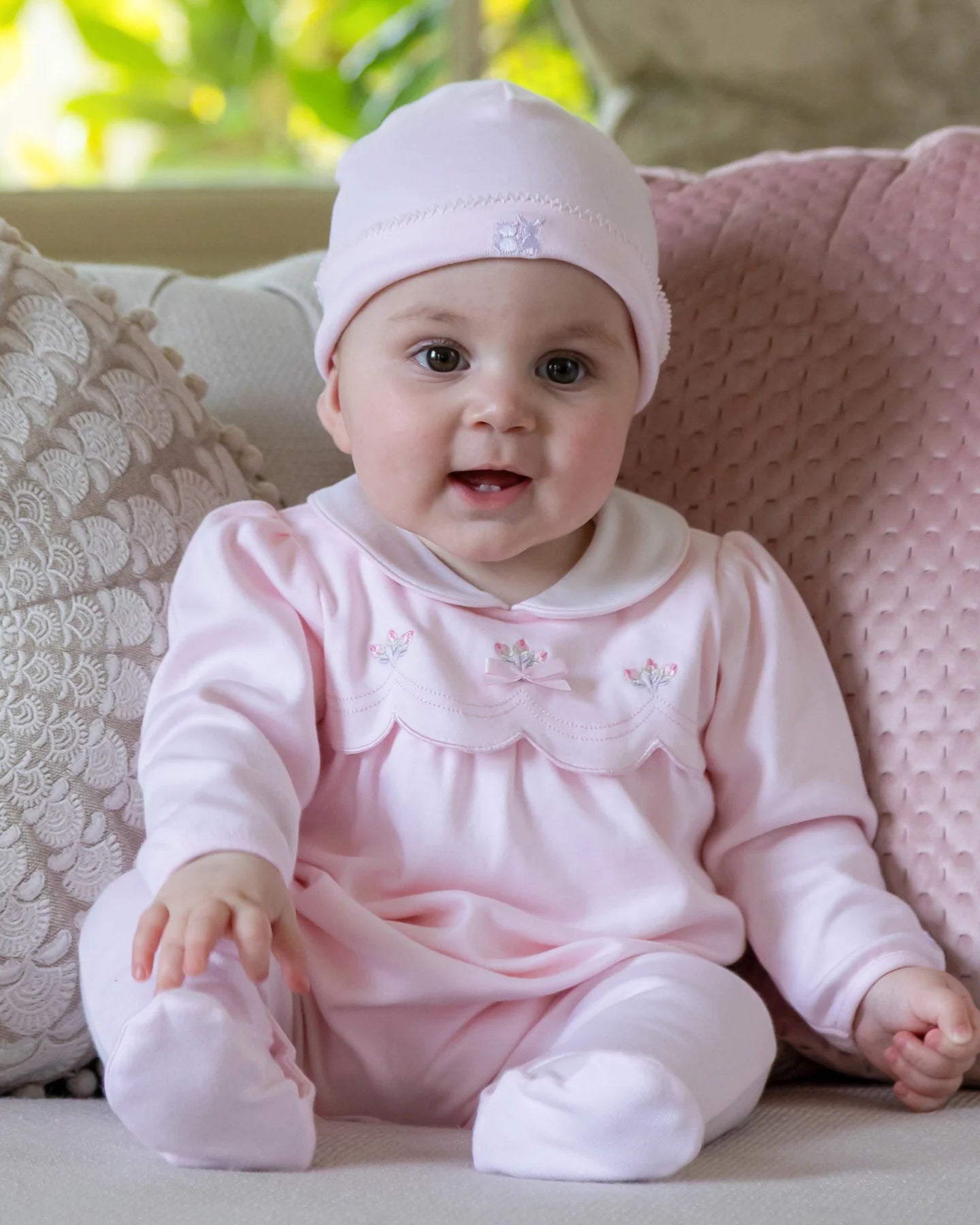 Baby girl in Emile et Rose Matilda pale pink newborn outfit gift set