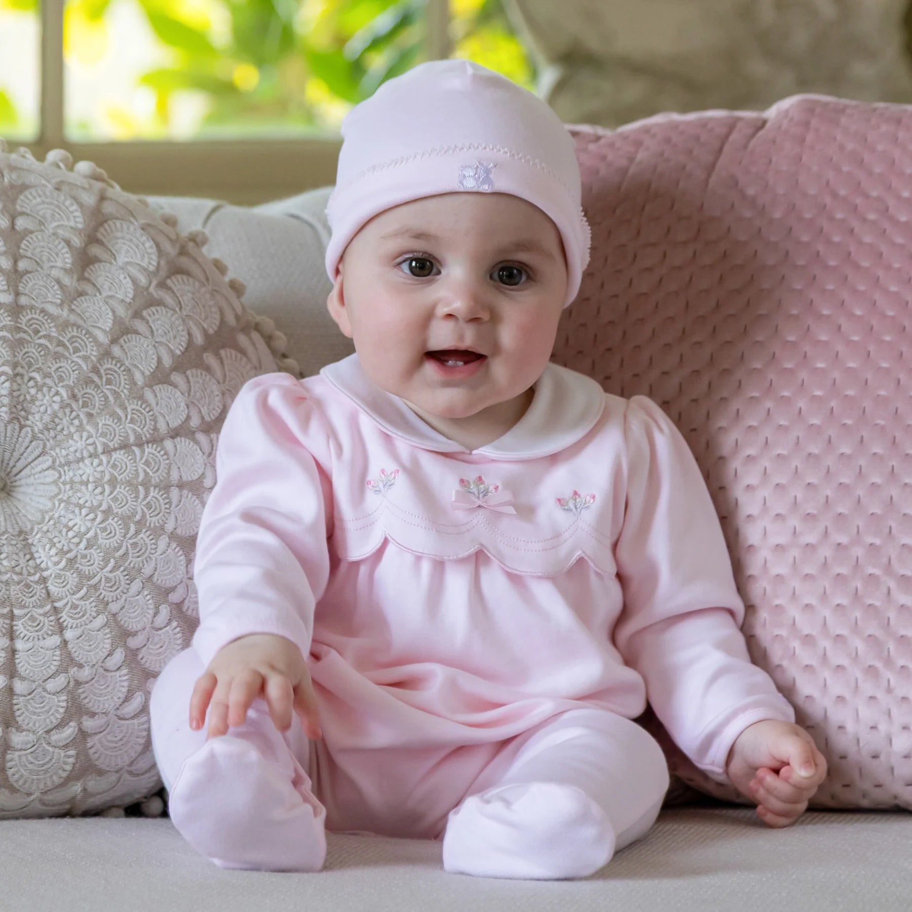 Baby girl in Emile et Rose Matilda pale pink newborn outfit gift set