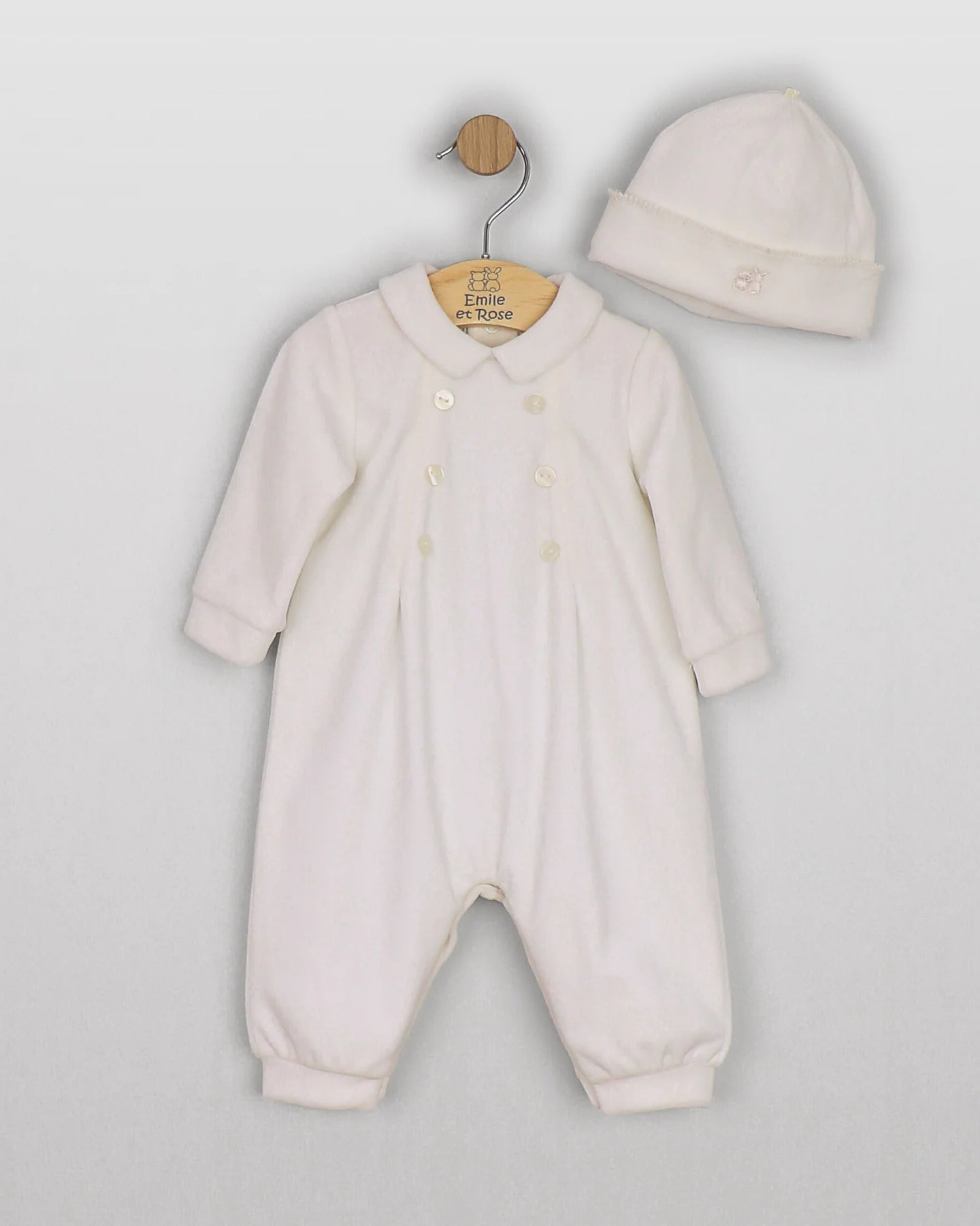 Baby boy wearing the Emile et Rose Marshall ivory velour romper while sitting