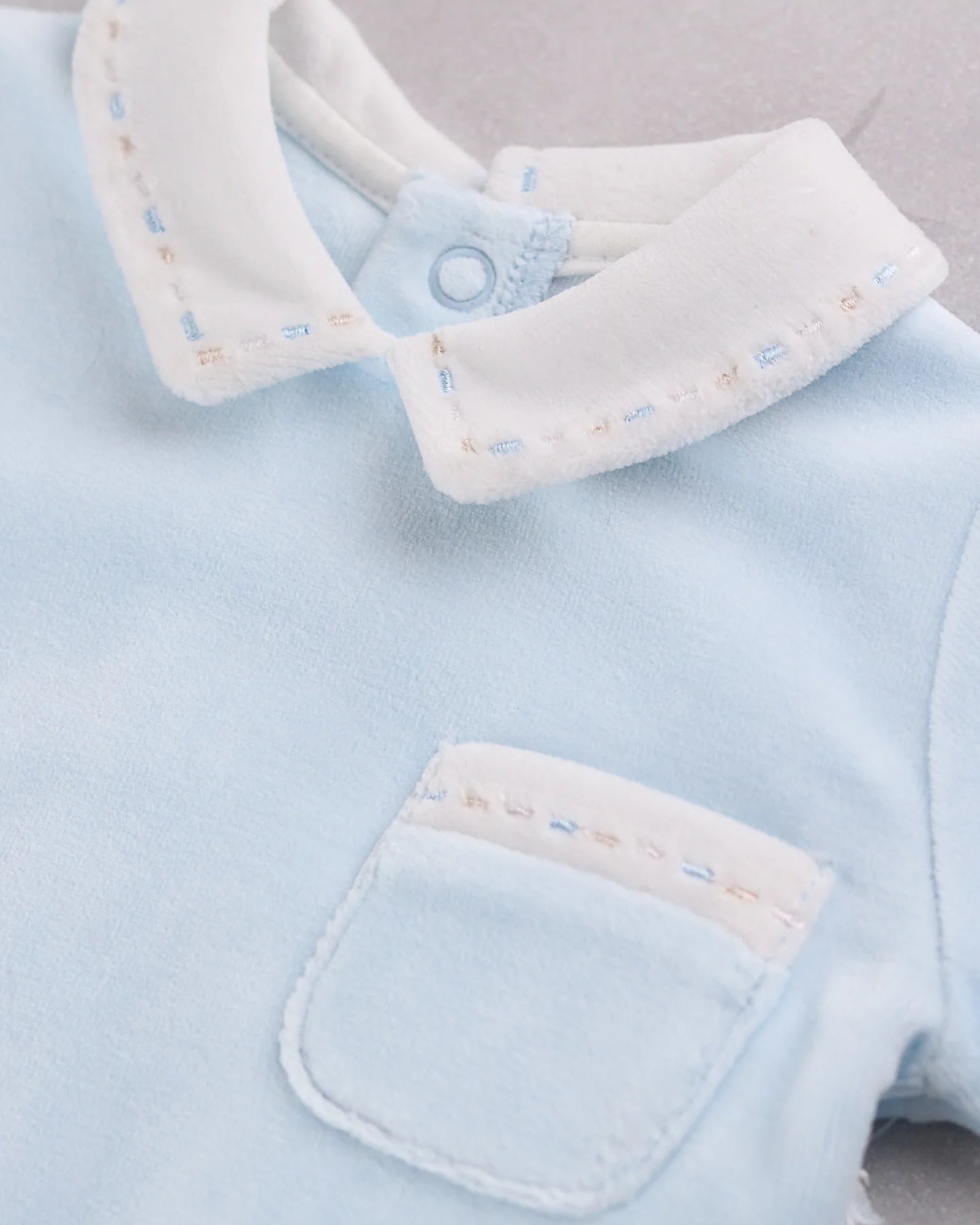 Close-up of Emile et Rose Mason white embroidered collar detail