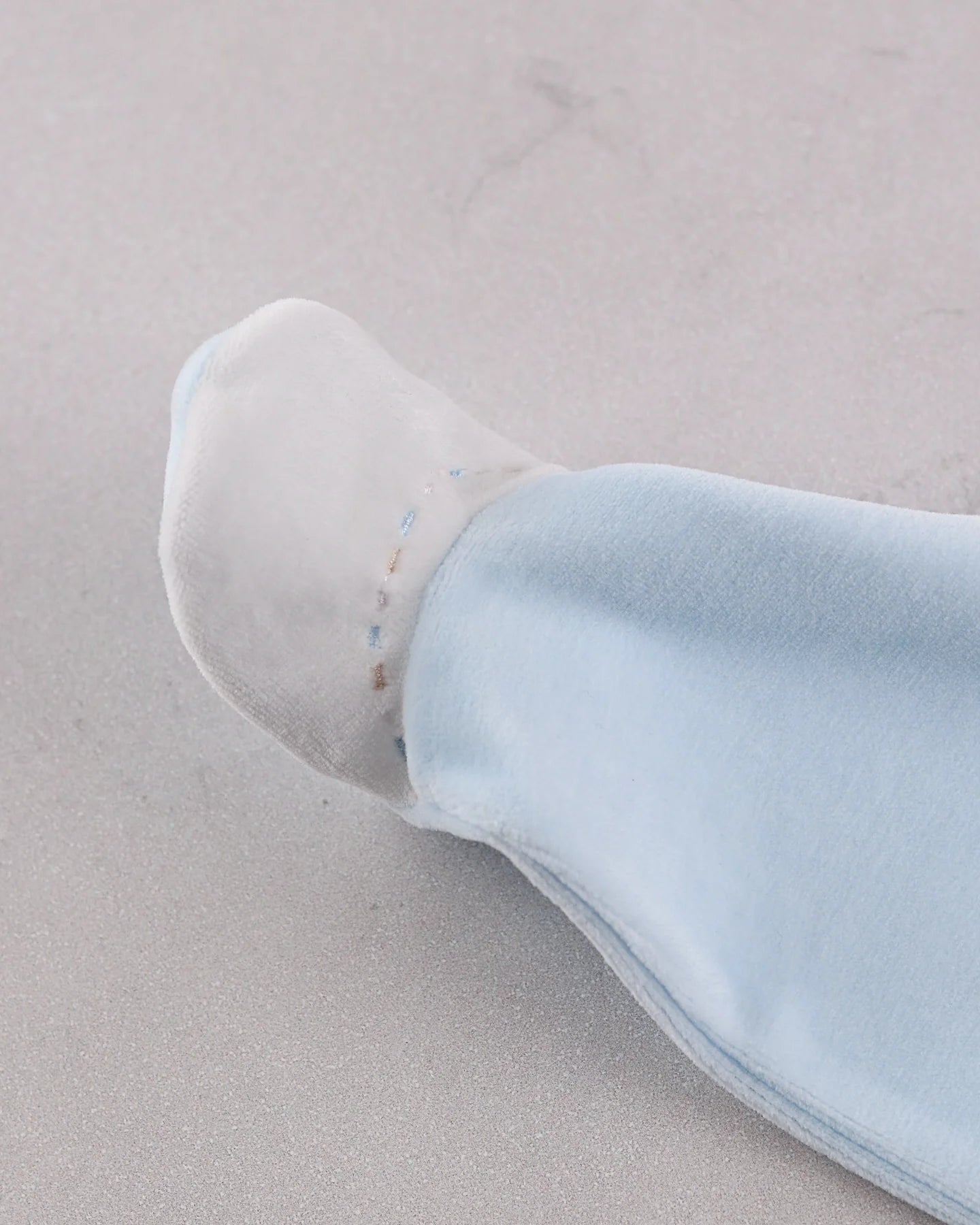 Close-up of Emile et Rose Mason Baby boys embroidered foot detail