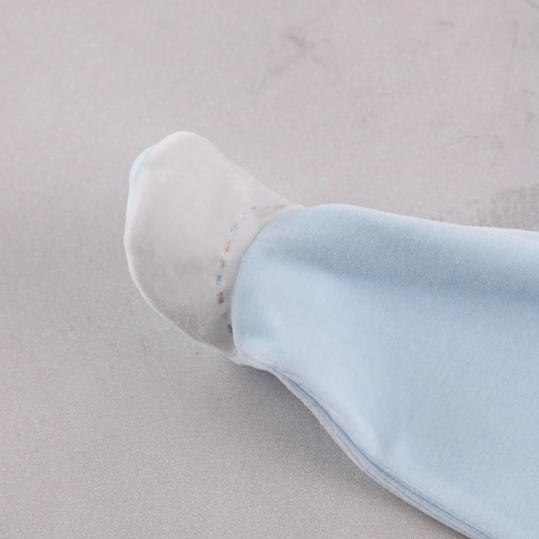 Close-up of Emile et Rose Mason Baby boys embroidered foot detail