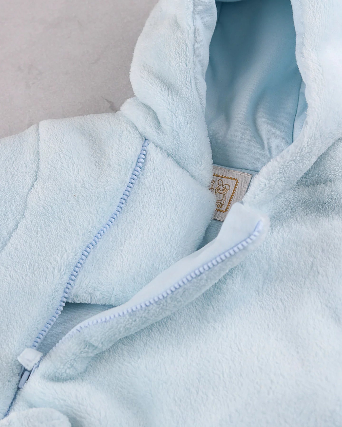 Close-up of the hood lining on the Emile et Rose Axel baby boys blue jacket