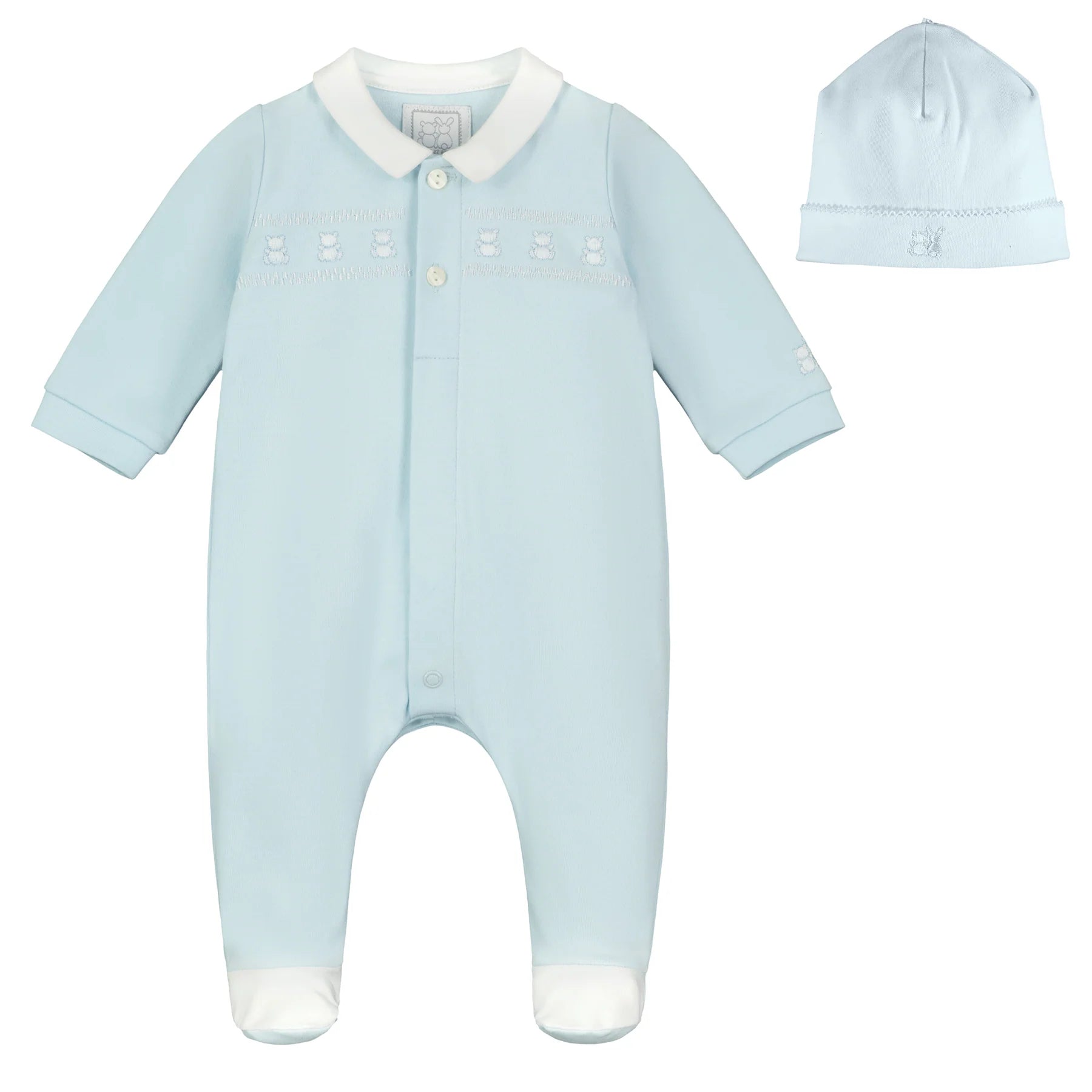Flatlay of Emile et Rose Fisher baby boys blue babygrow and hat