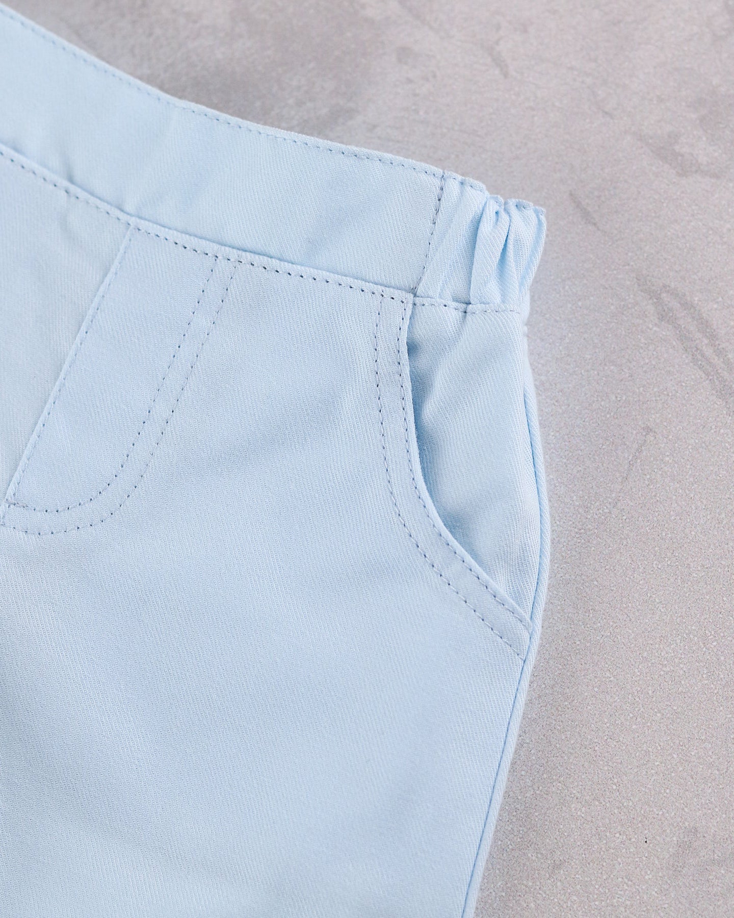 Close-up of Emile et Rose Martin ktrousers with elastic waistband