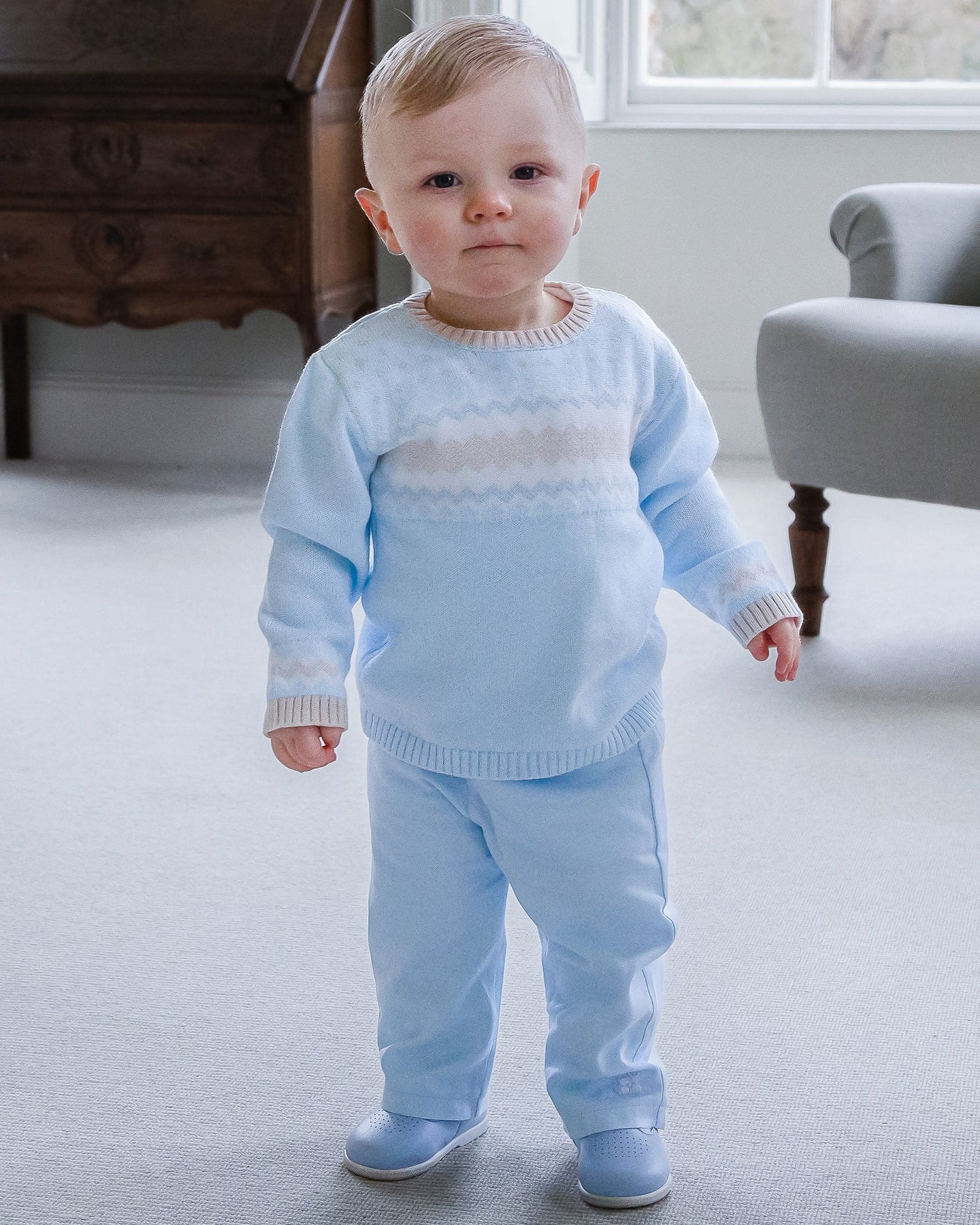 Baby boy wearing Emile et Rose Martin knitted outfit gift set