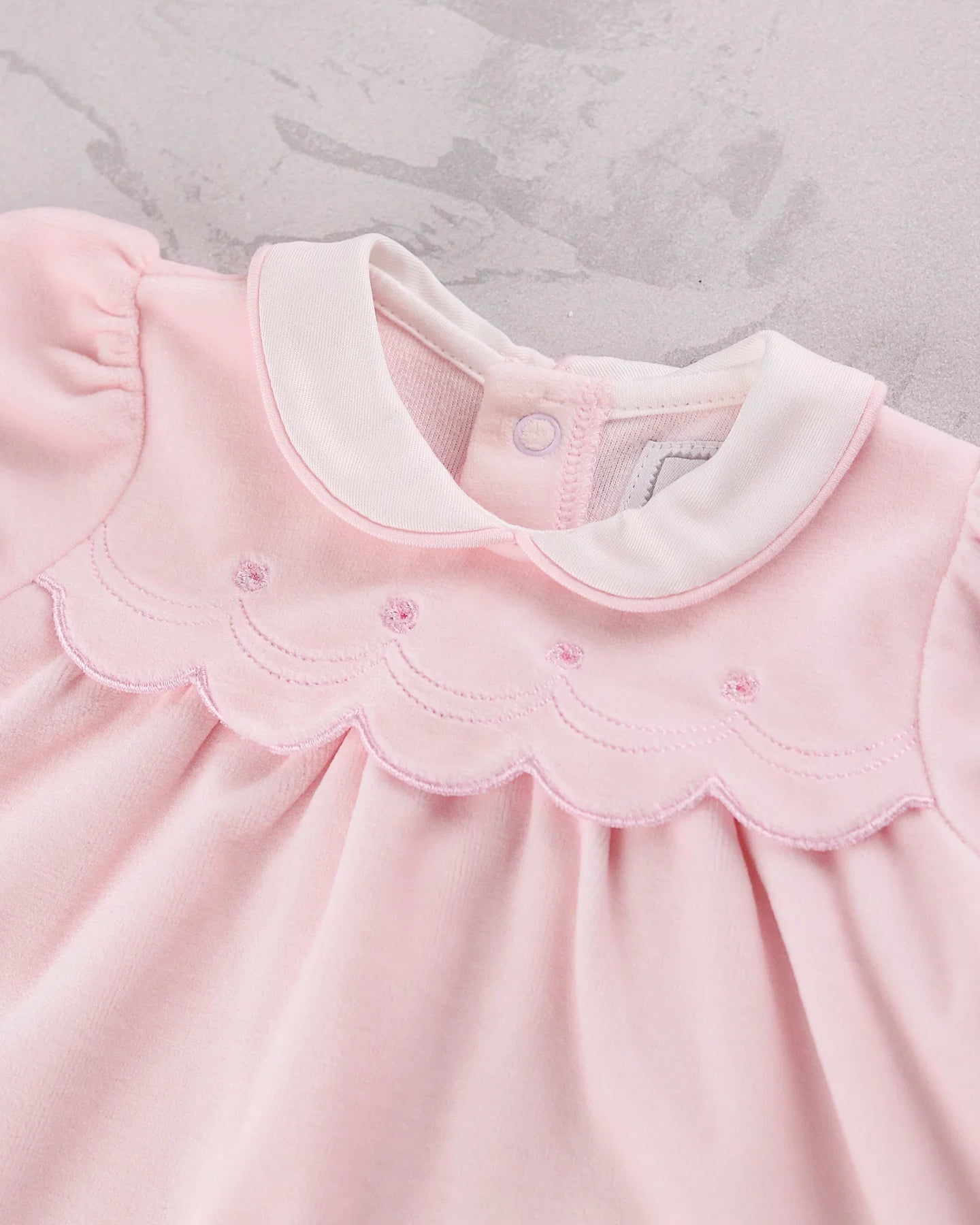 Close-up of the embroidered scalloped yoke on the Emile et Rose Michelle baby girls velour top from gift set