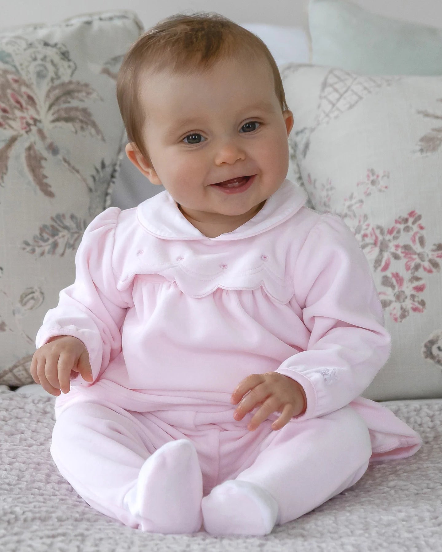 Baby wearing the Emile et Rose Michelle pale pink velour outfit gift set