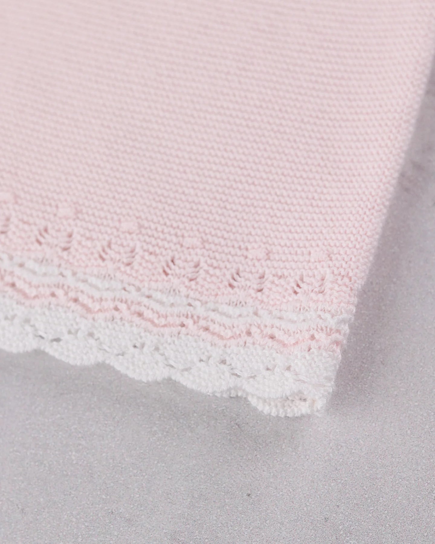 Close-up of the knitted detail on the Pink baby girls Emile et Rose Millie dress