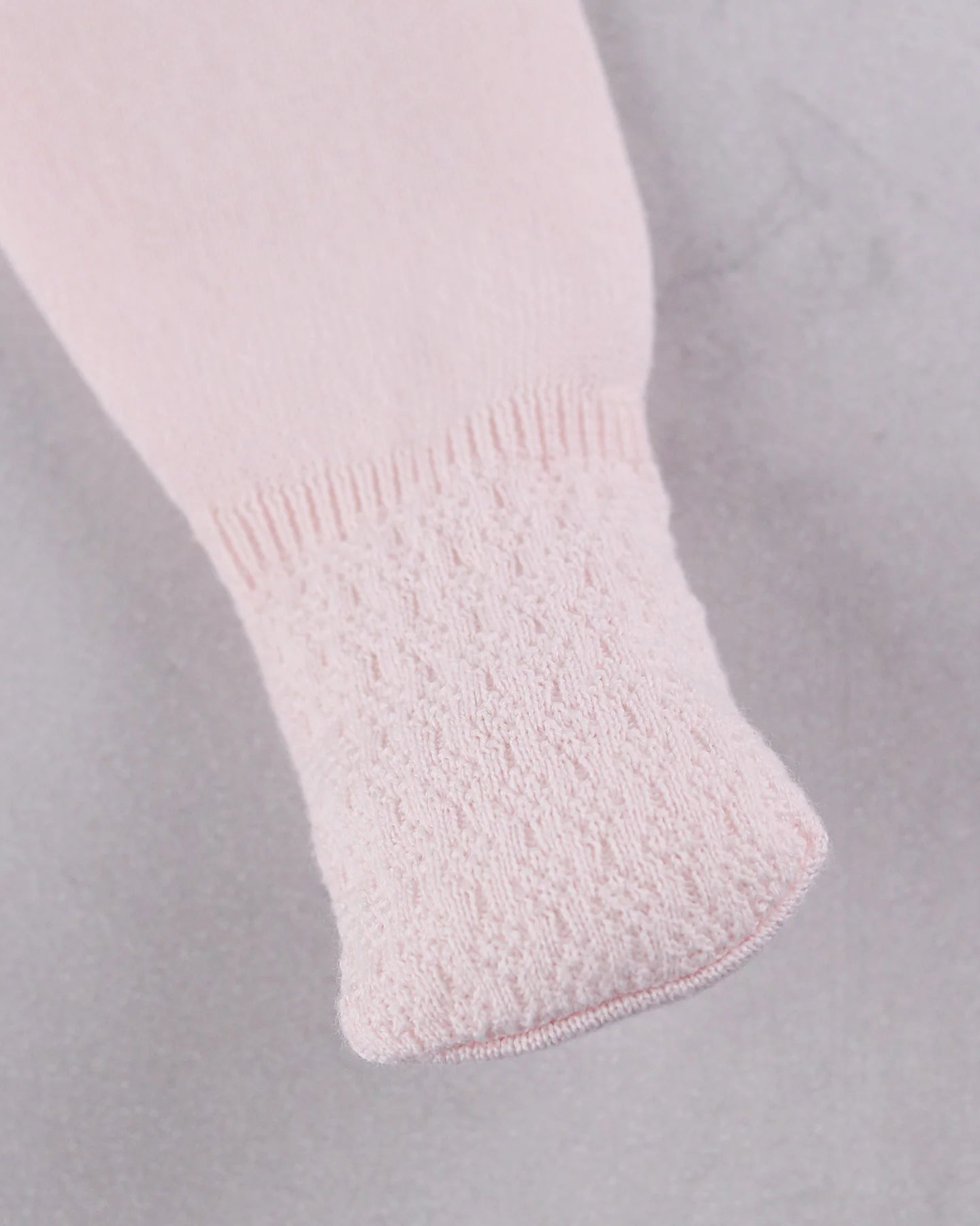 Coordinating footed leggings from the Emile et Rose Minny baby girls knit outfit set