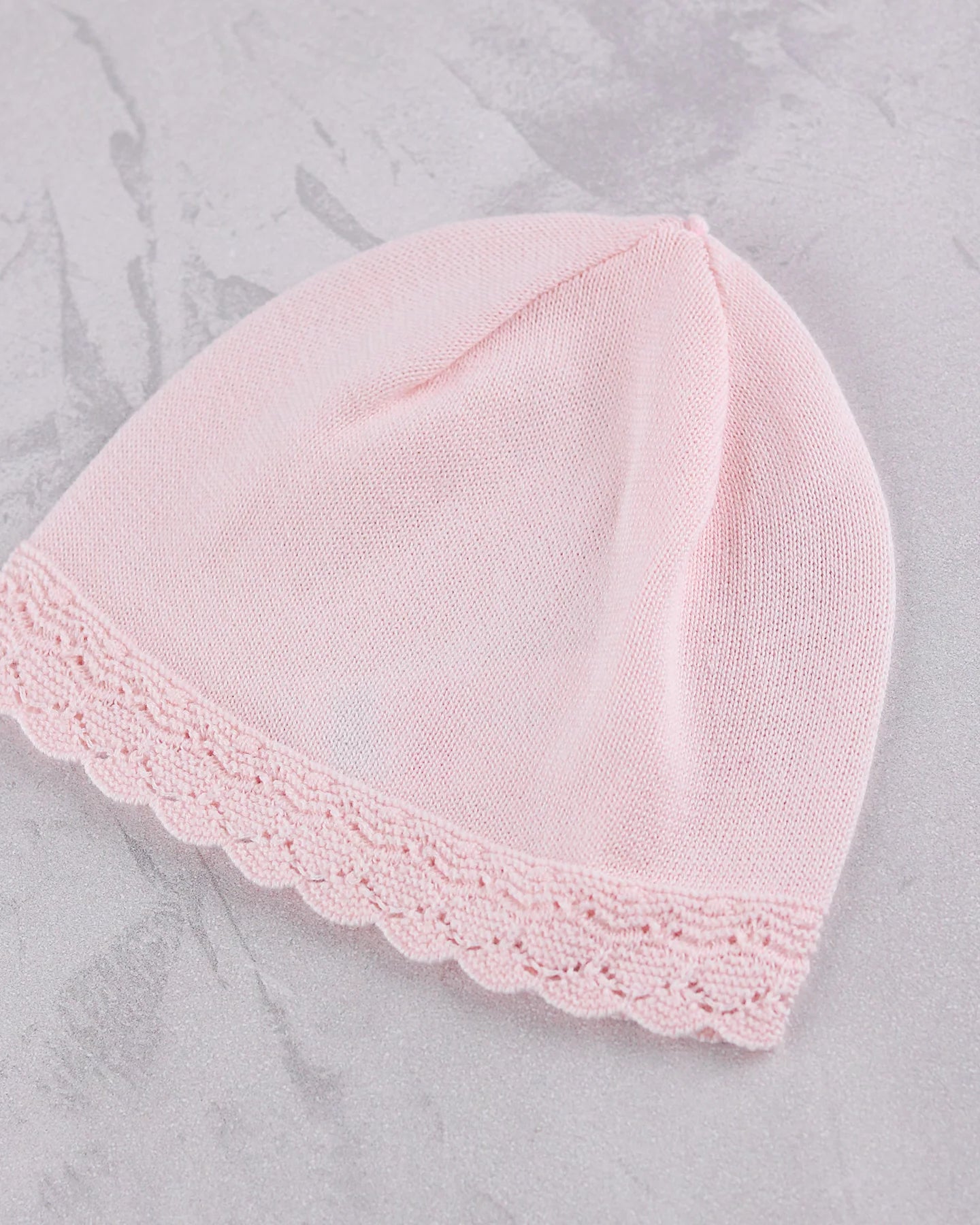 Matching pale pink knitted hat from the Emile et Rose Minny baby girls outfit set