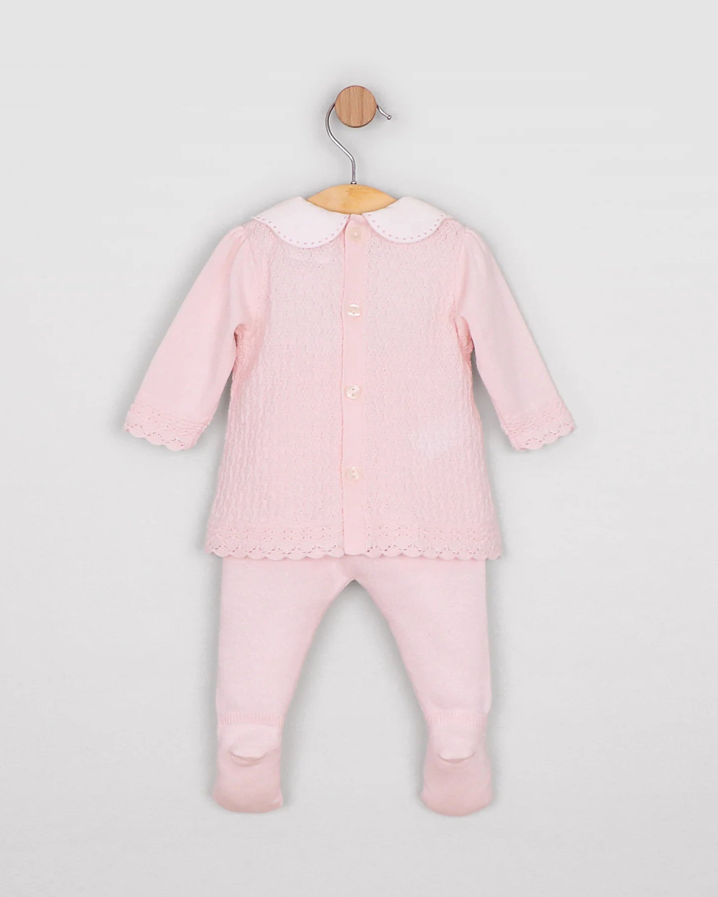 Back view of the Emile et Rose Minny pale pink baby girls knit top showing button fastening