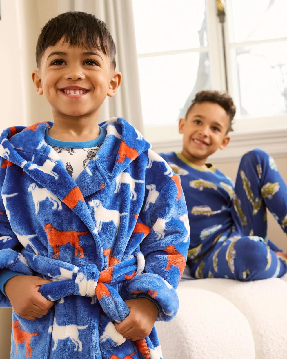 Boy wearing Hatley blue Dog Silhouette fleece dressing gown