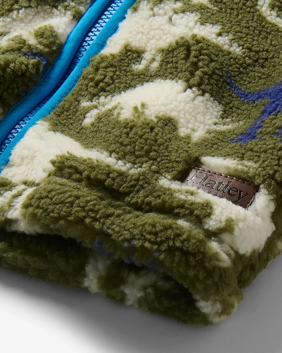 Hatley Dino Silhouette sherpa jacket close-up with blue trim