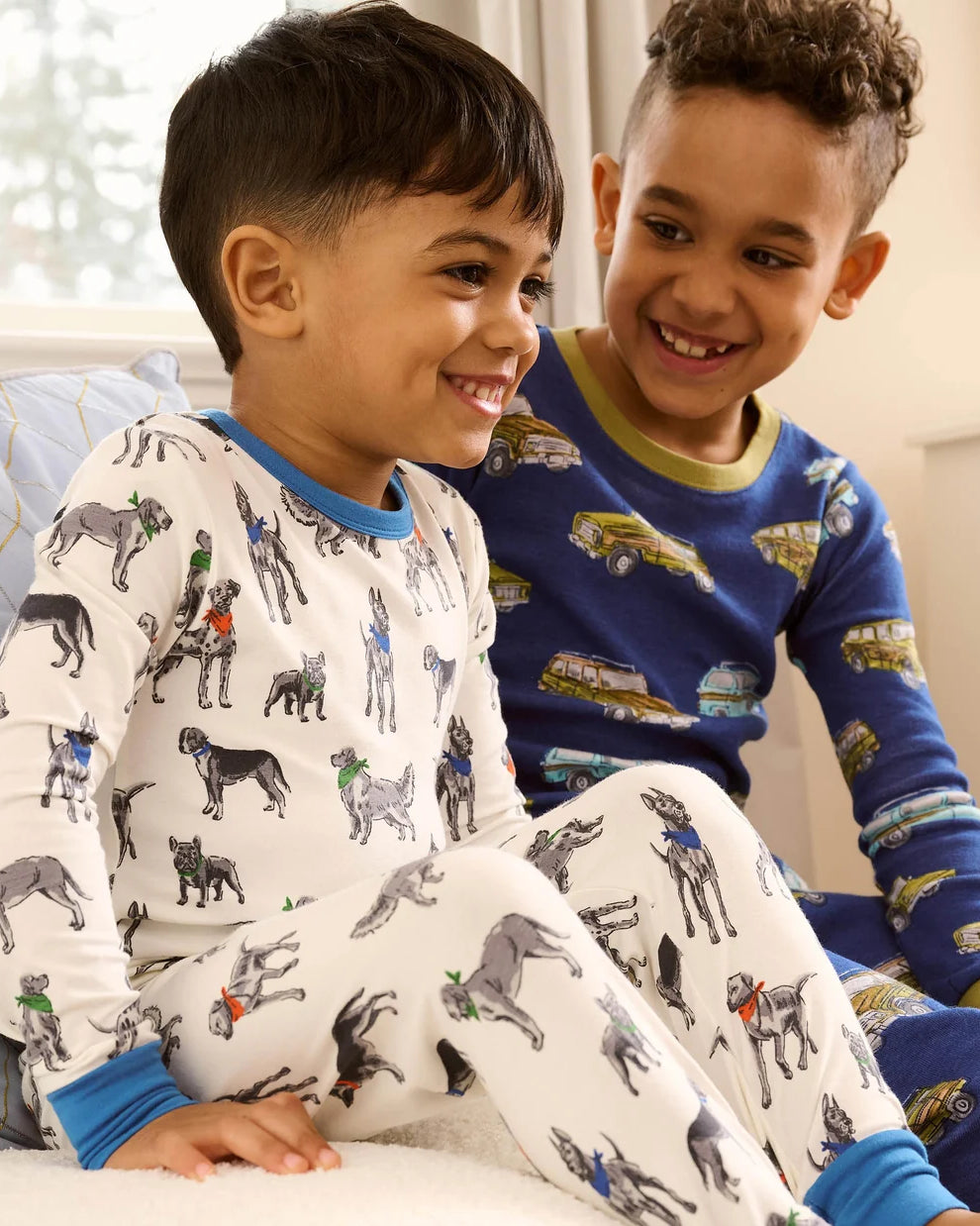 Hatley Boys Vintage Trucks pyjamas worn by child showing blue printed two-piece PJs