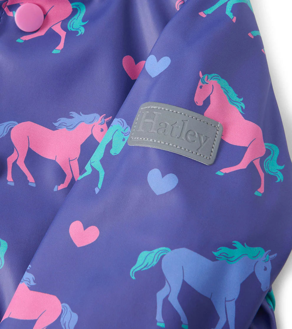 Pocket and heart badge detail on Hatley Hearts & Horses kids raincoat