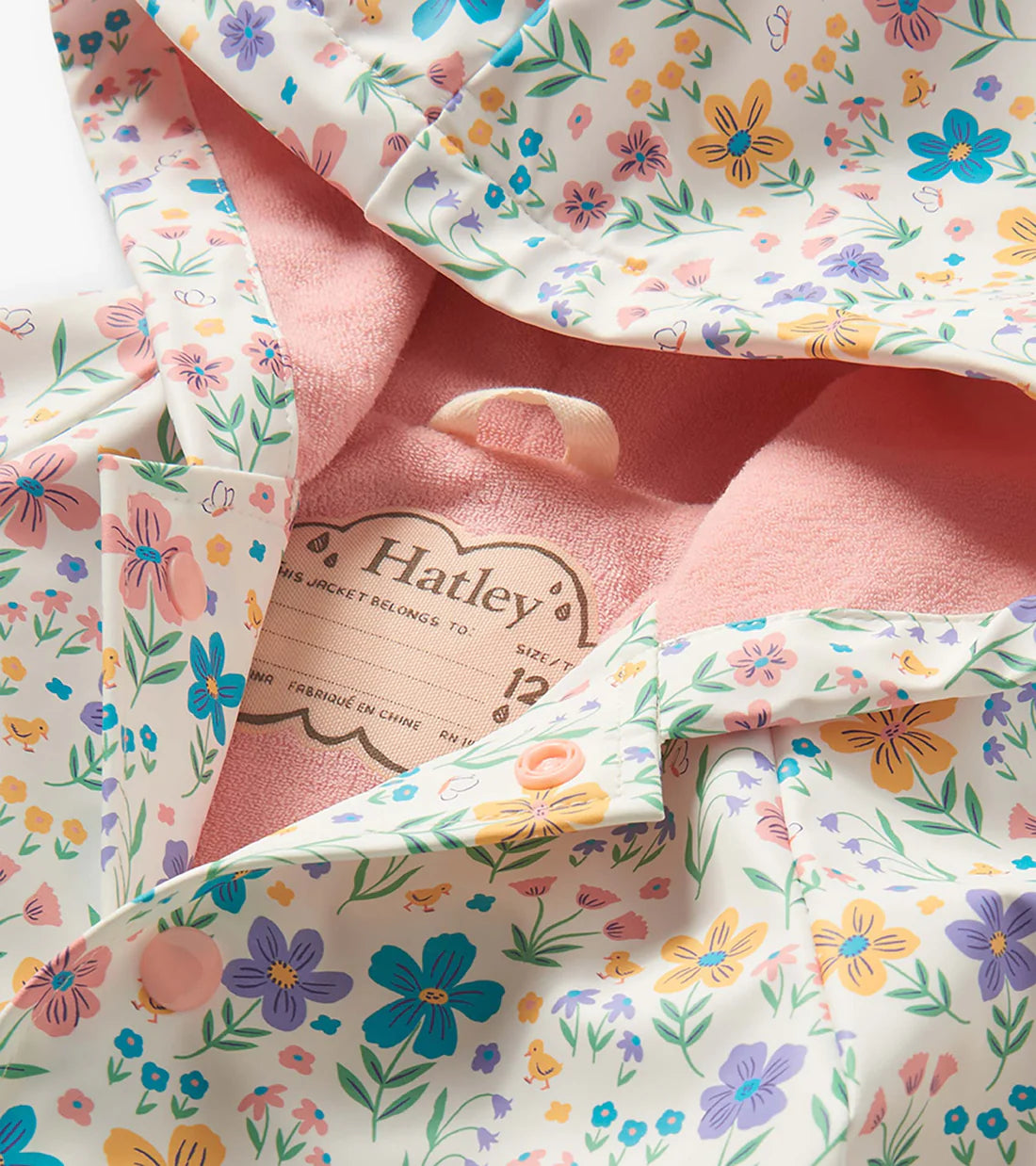Close-up of Hatley girls raincoat pink terry lining inside hood