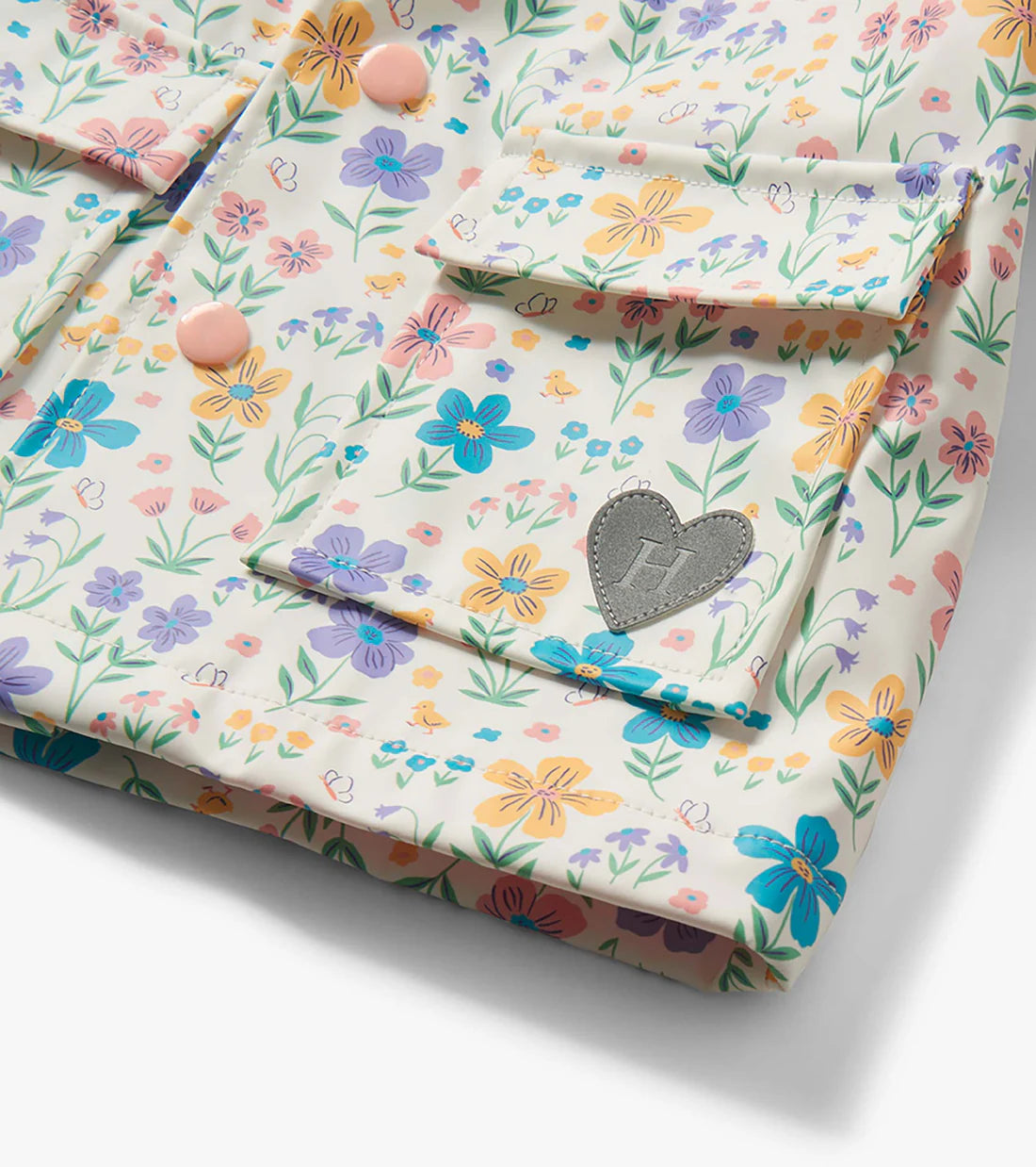 Close-up of Hatley girls floral raincoat pocket flap detail