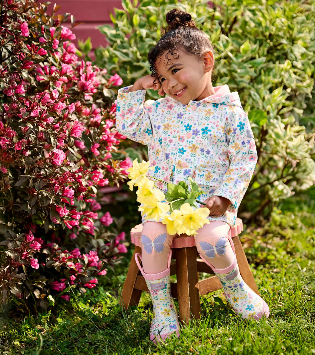 Hatley girls waterproof floral wellies worn outdoors