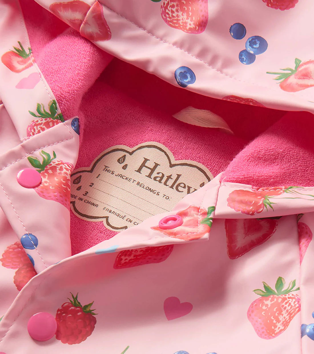 Close-up of Hatley girls rain coat pink terry lining inside hood