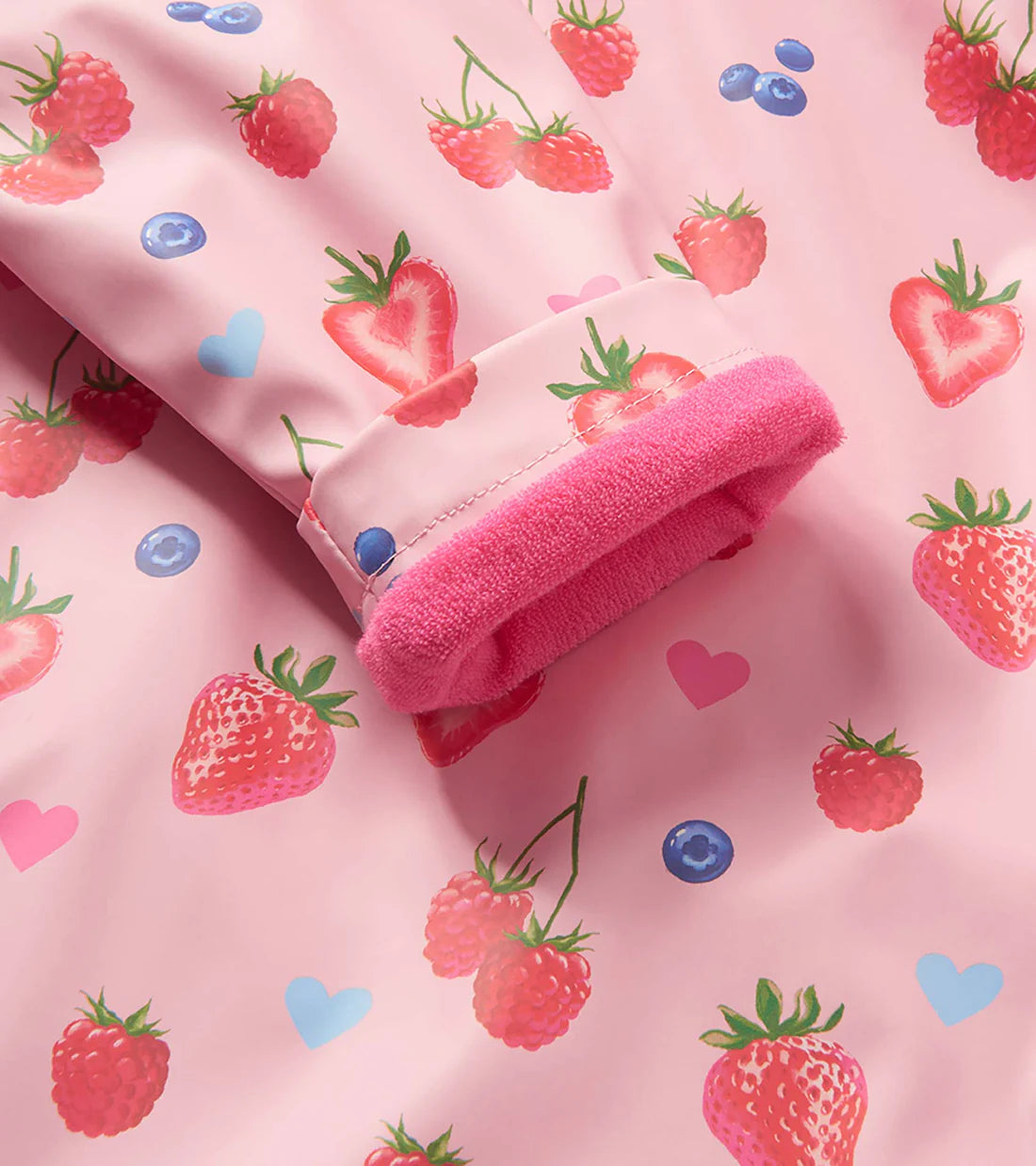Close-up of cuff on Hatley Summer Berries rain coat with pink lining