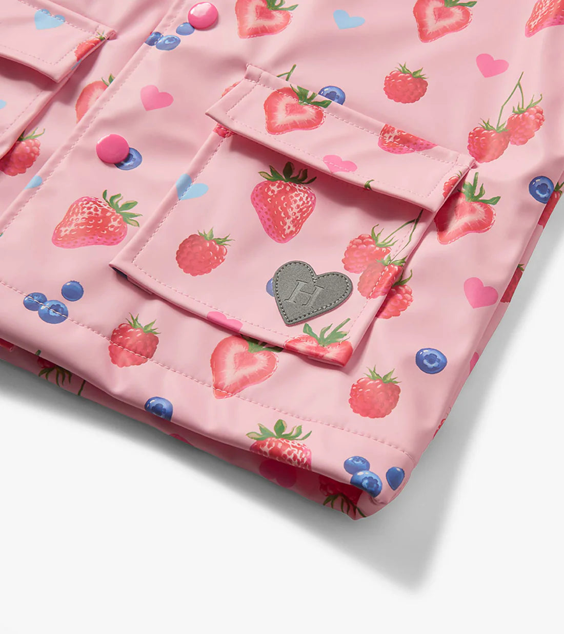 Close-up of pocket flap detail on Hatley Summer Berries girls rain coat