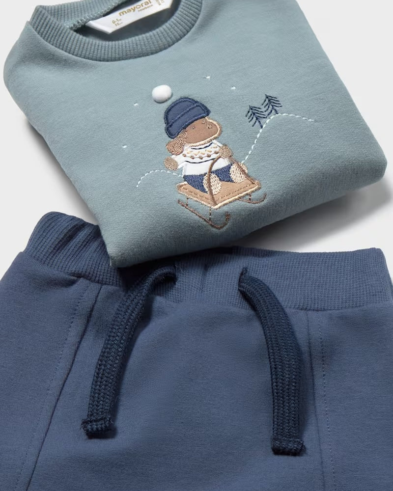 Close-up of the Mayoral baby boys blue sweatshirt with cute winter dog motif and navy drawstring joggers