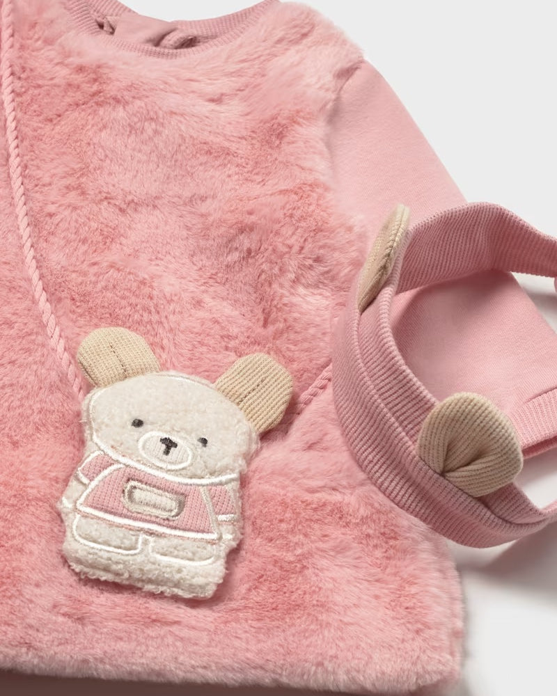 Close-up of the Mayoral pink baby dress with textured finish and mouse bag appliqué