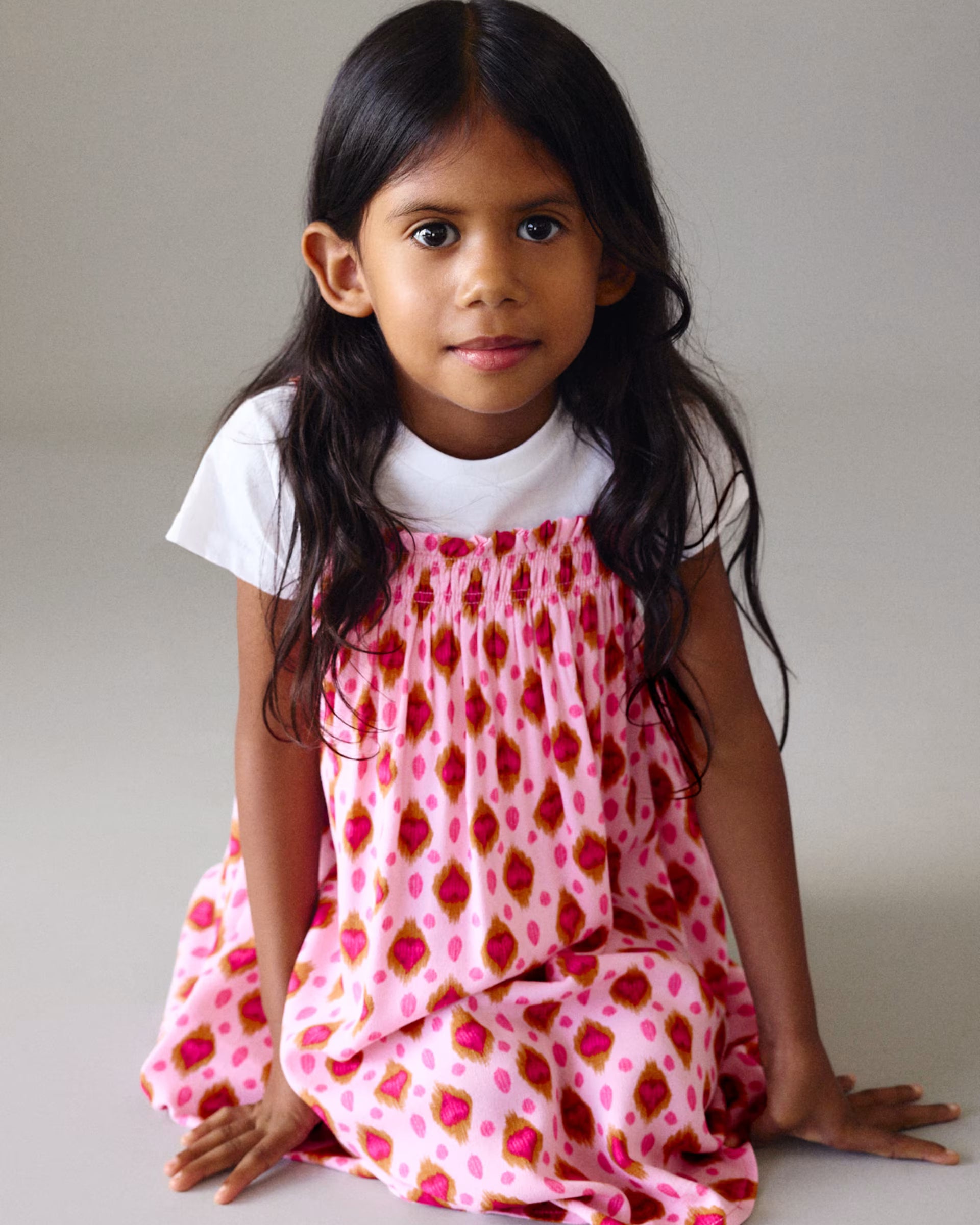 Mayoral girls pink patterned dress on girl aged 6