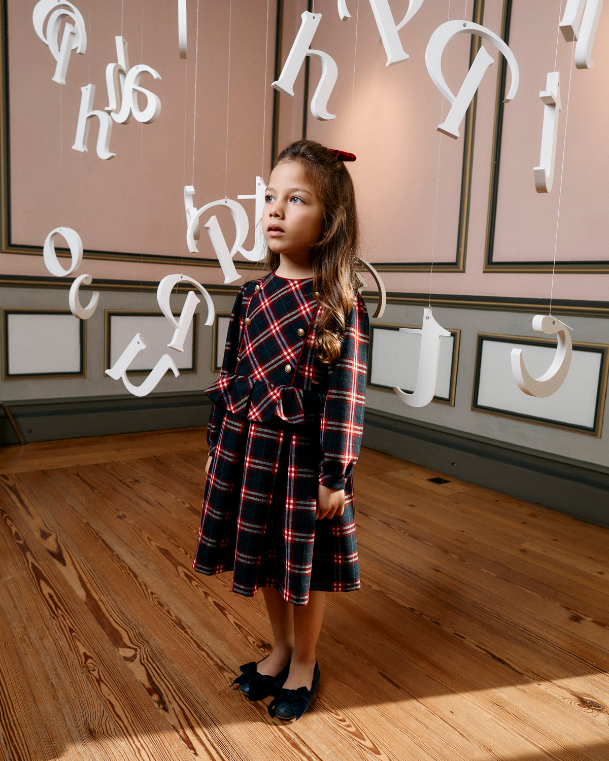 Girl wearing Patachou Balmoral navy and red tartan Christmas dress