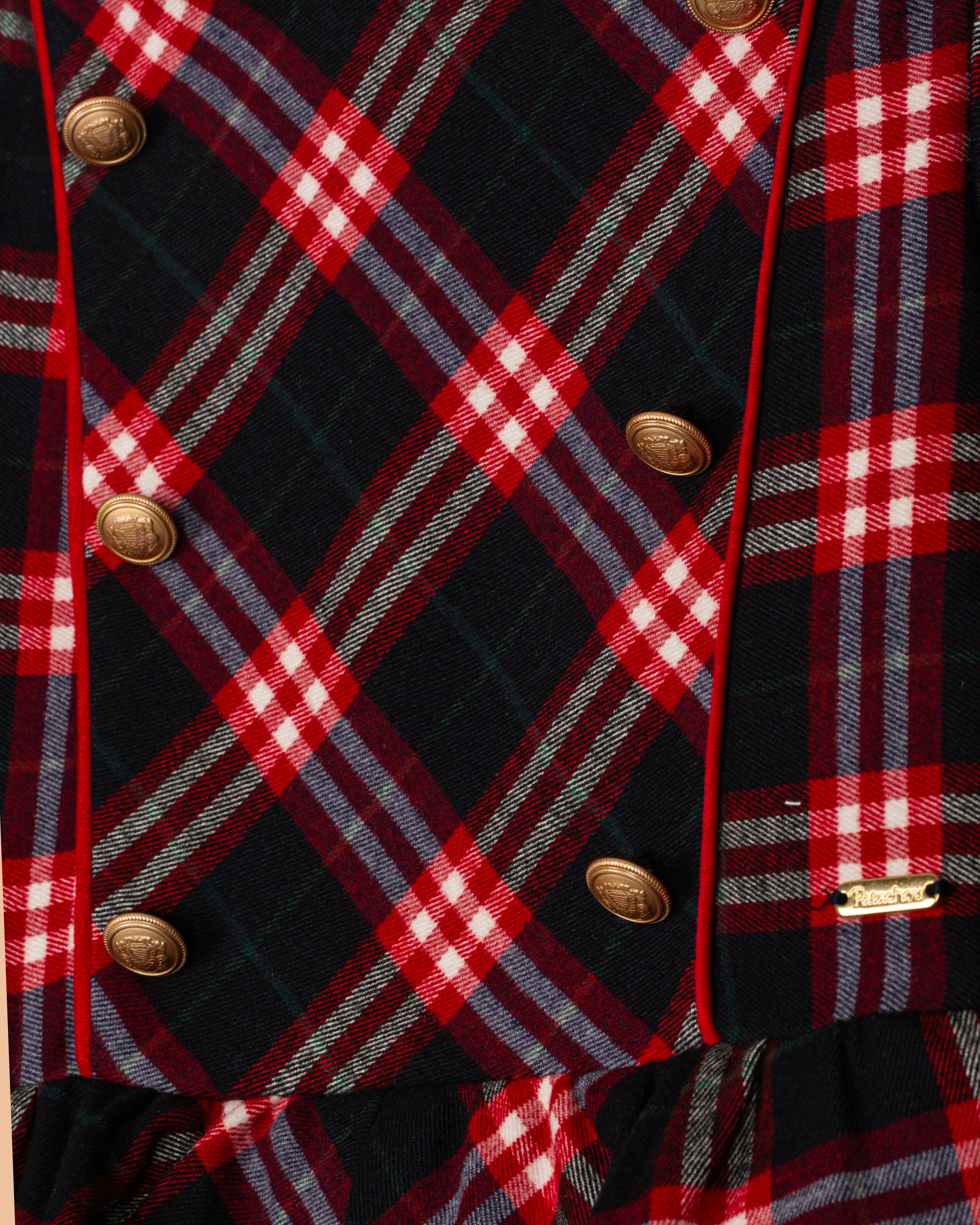 Close-up of Patachou Balmoral tartan girls dress with gold button detailing