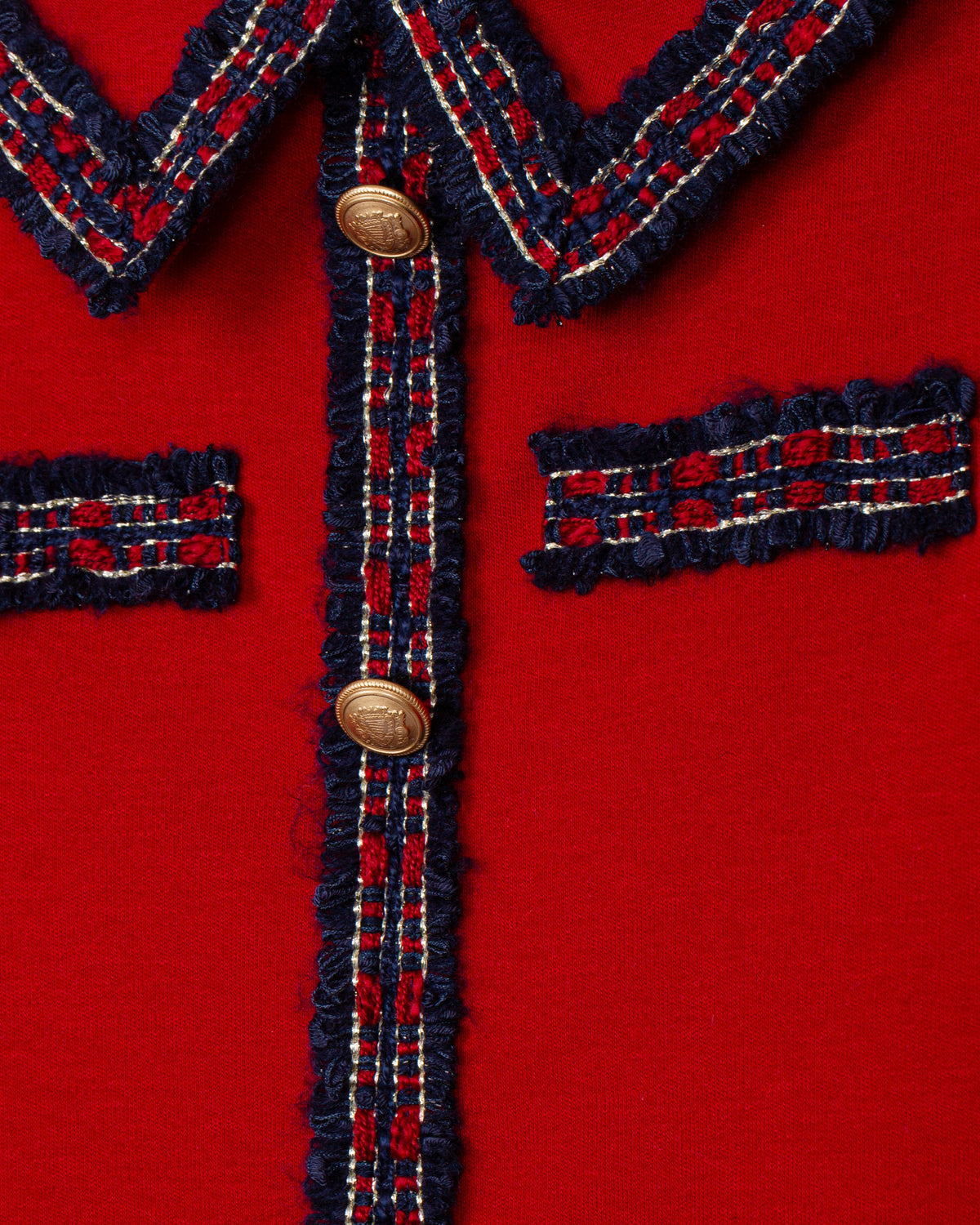 Close-up of Patachou girls red knit dress with contrast trim and buttons