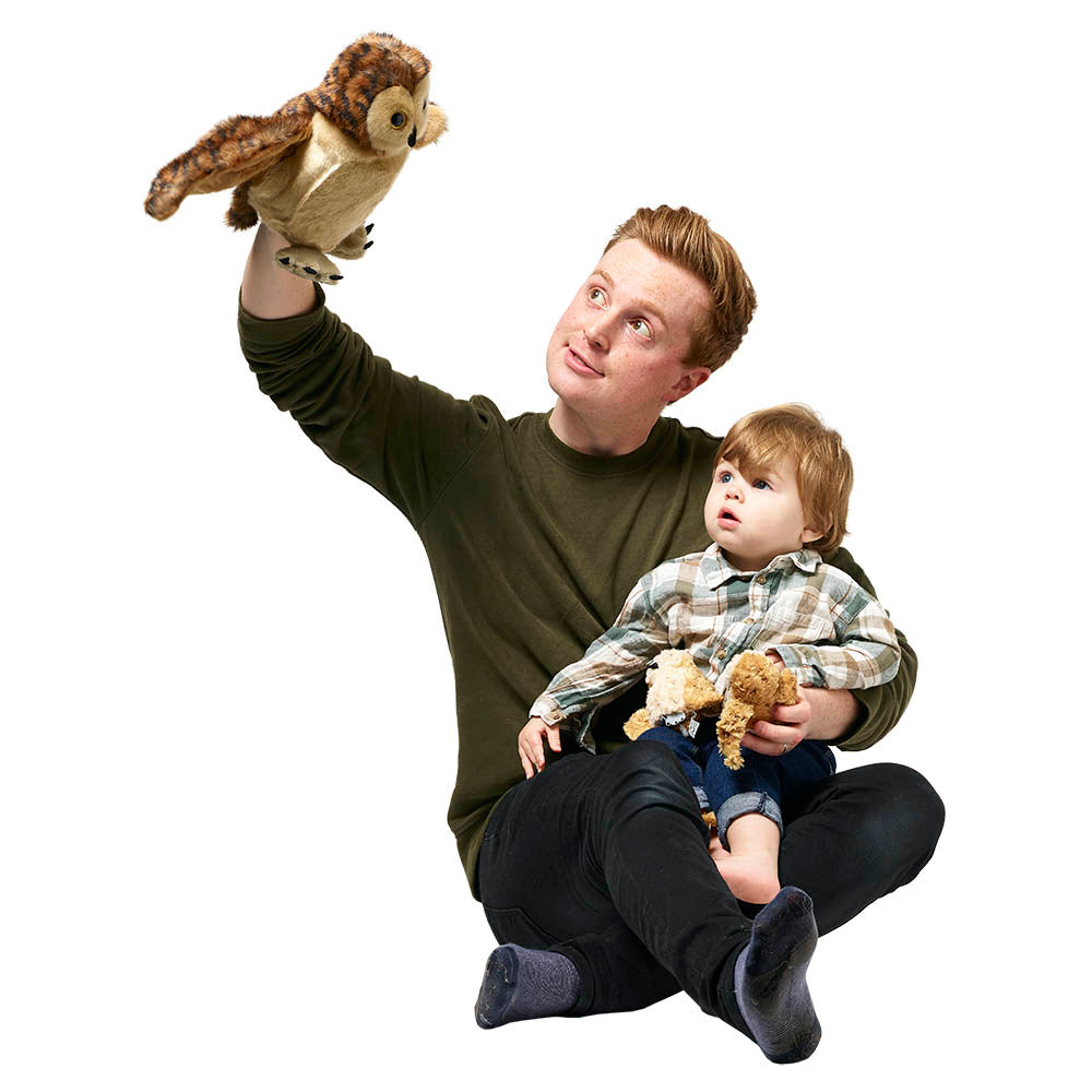 Adult using the Hide-Away tawny owl puppet during interactive play with a young baby