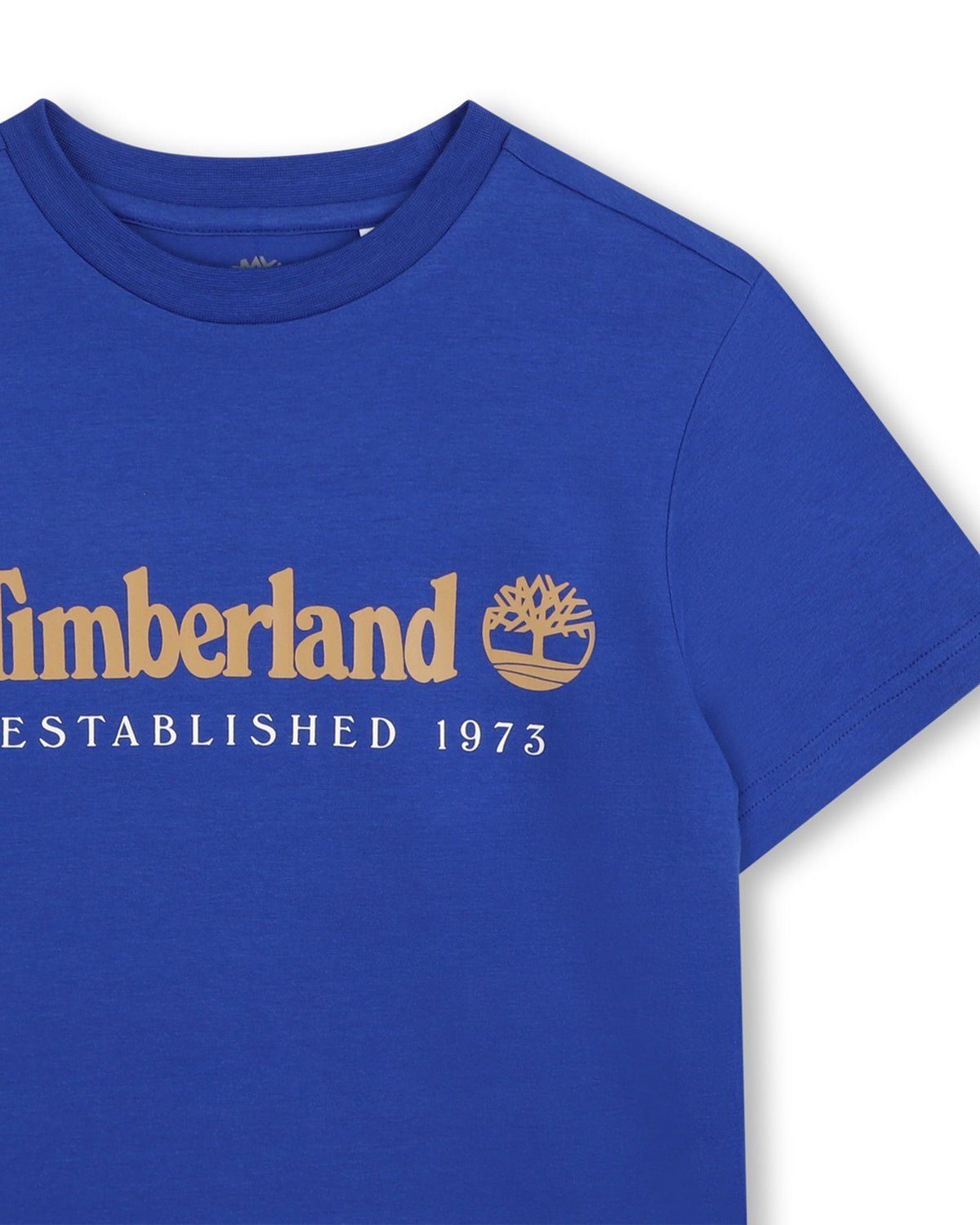 Close-up of Timberland boys blue T-shirt with gold logo and Established 1973 print