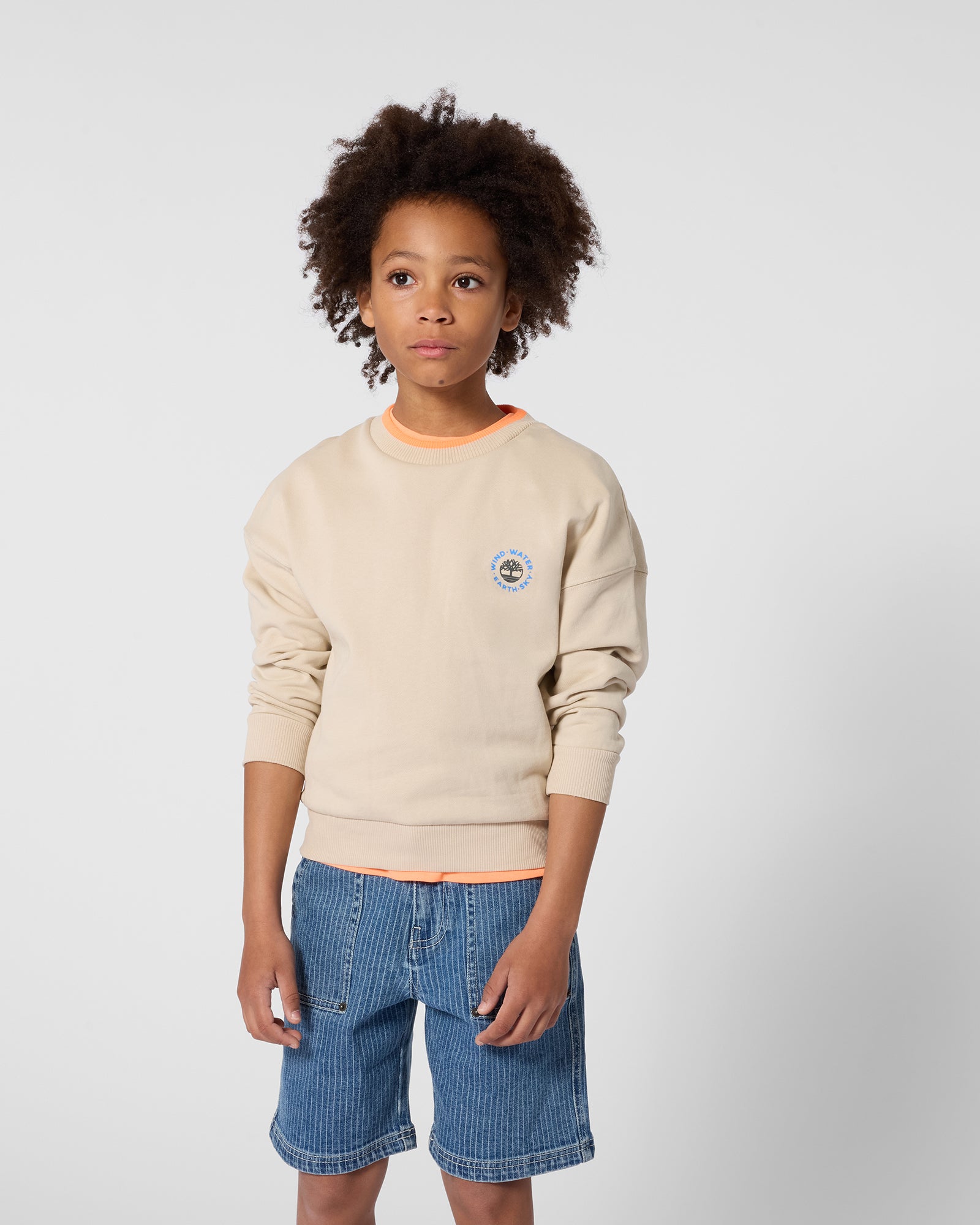 Timberland boys logo sweatshirt styled with denim shorts