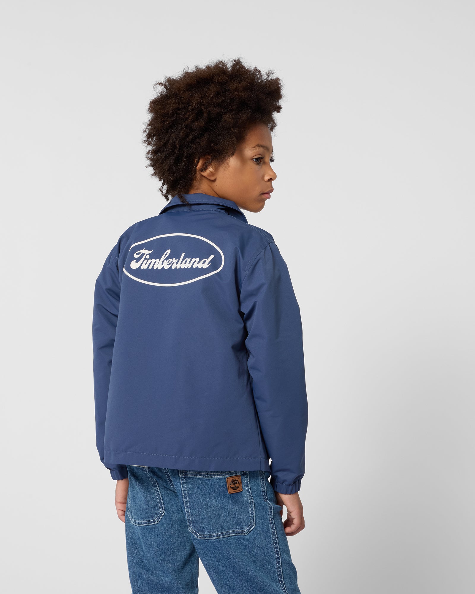 Timberland boys collared jacket back view worn with Timberland logo