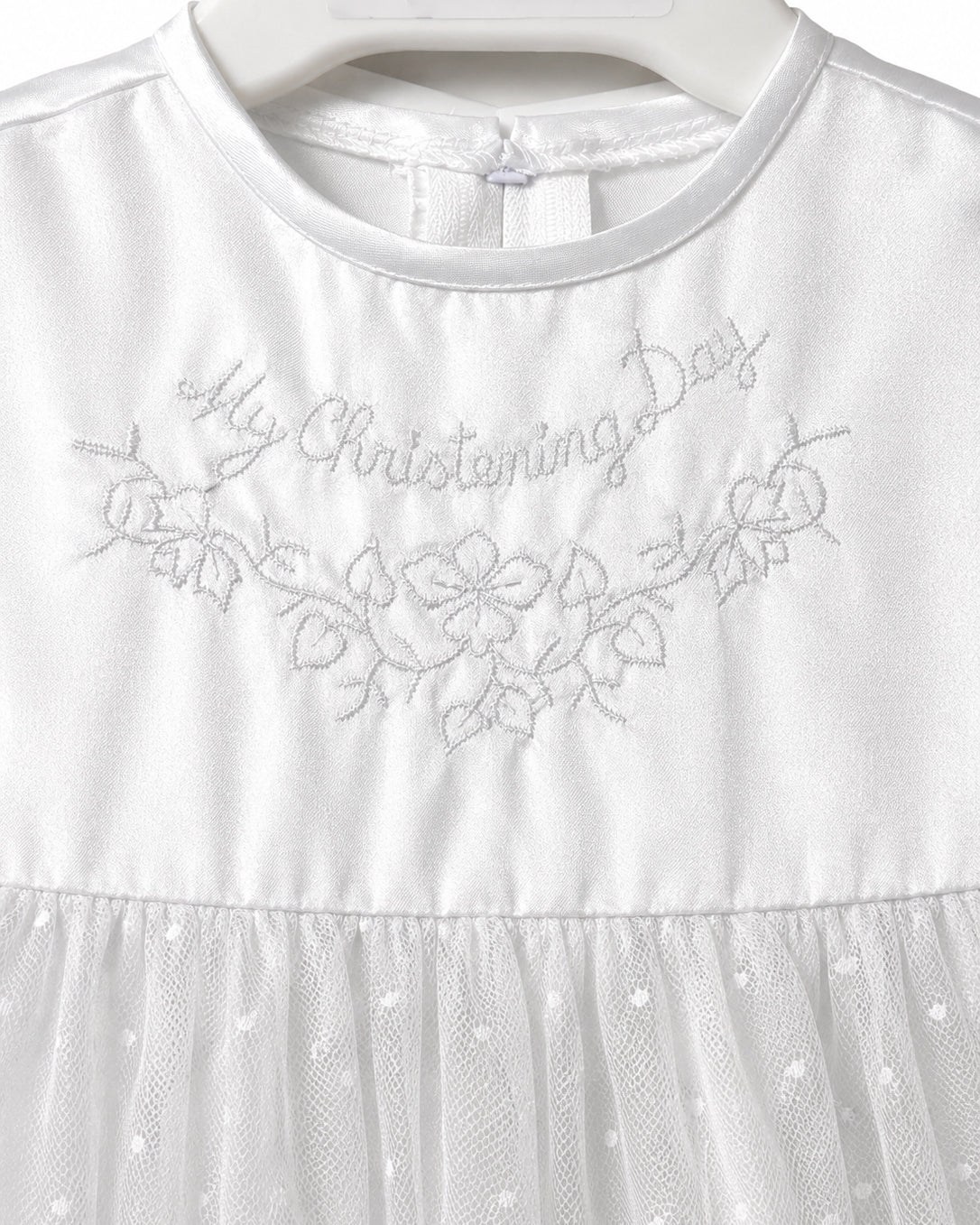 Close-up of My Christening Day floral embroidery on the Visara white satin gown
