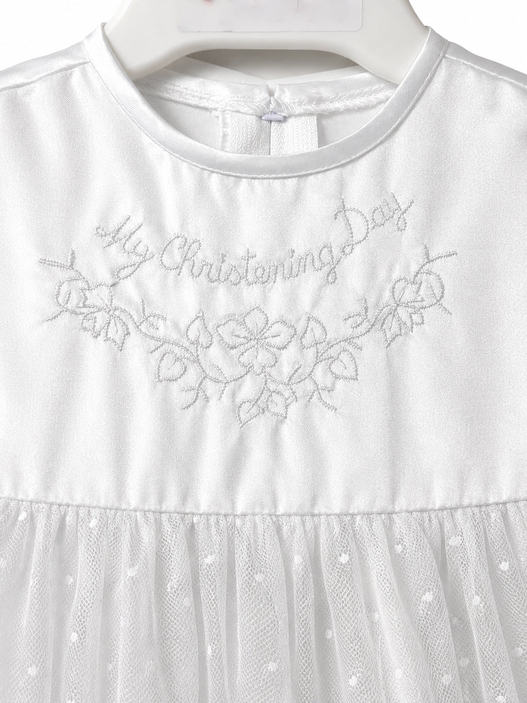 Close-up of My Christening Day floral embroidery on the Visara white satin gown
