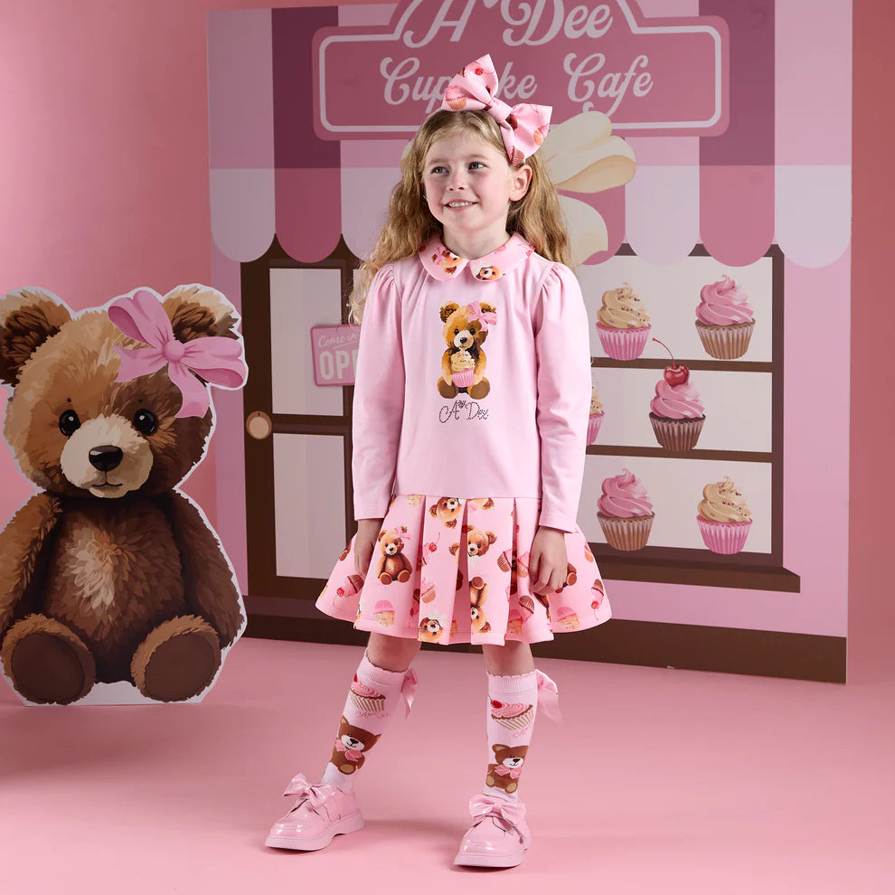 A Dee Leah pink teddy print knee-high socks on girl aged 5-7