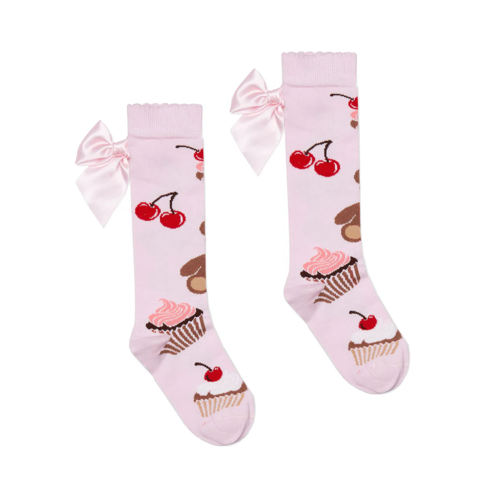 A Dee Leah girls pink knee-high socks – side/back view on little girl aged 5