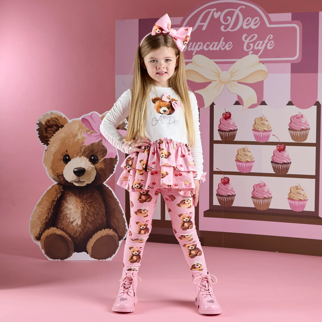 A Dee Teddy Bear pink hairband on girl ages 5-6